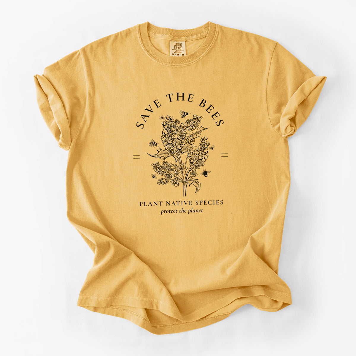 Golden wheat yellow Comfort Colors t-shirt laid flat, printed with a black ink wildflower bouquet with bees, framed by the words Save the Bees, Plant Native Species.