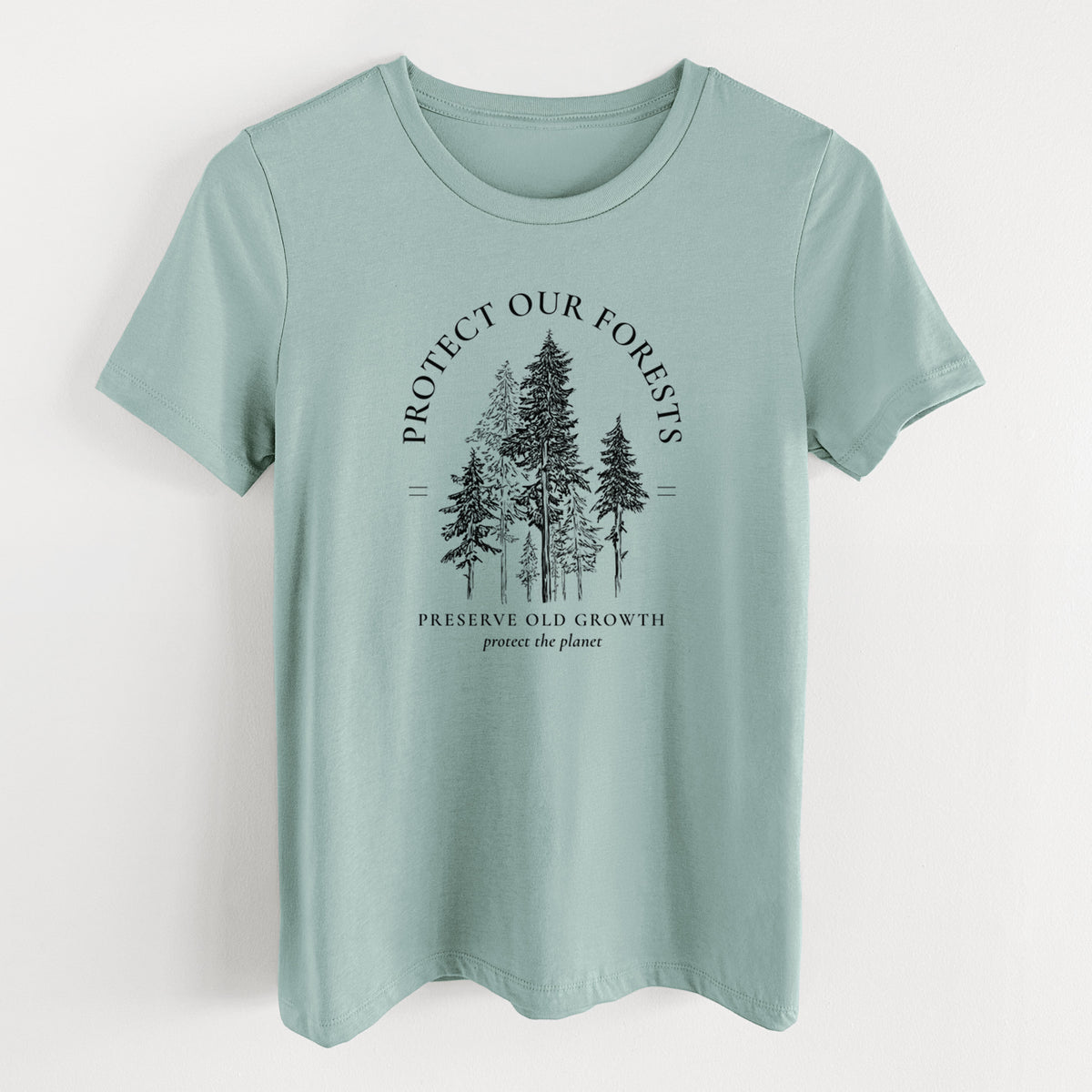 Dusty blue women's relaxed fit cotton t-shirt laid flat, printed with a black ink illustration of a stand of tall pine trees, framed by the words Protect Our Forests, Preserve Old Growth.