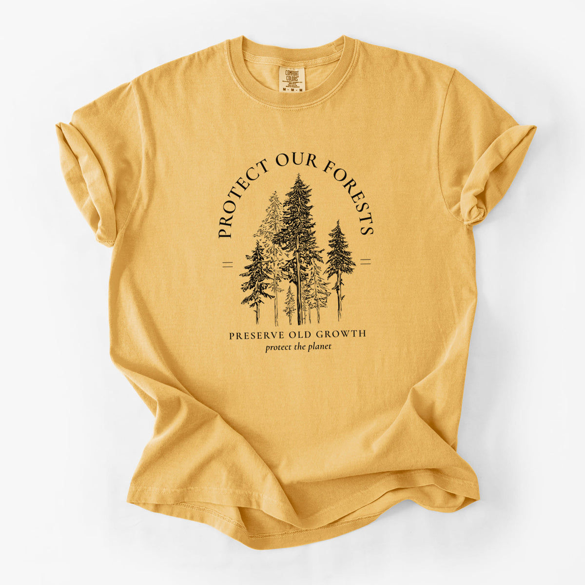 Golden wheat yellow Comfort Colors t-shirt laid flat, printed with a black ink illustration of a stand of tall pine trees, framed by the words Protect Our Forests, Preserve Old Growth.