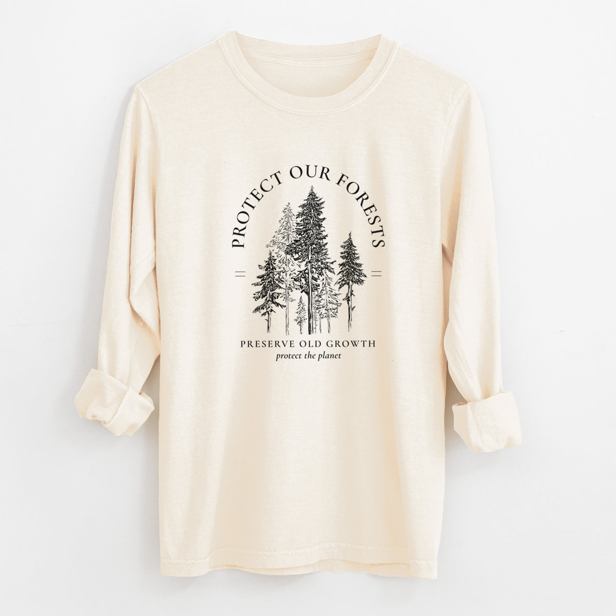 Ivory Comfort Colors long sleeve shirt laid flat with the cuffs rolled, printed with a black ink illustration of a stand of tall pine trees, framed by the words Protect Our Forests, Preserve Old Growth.