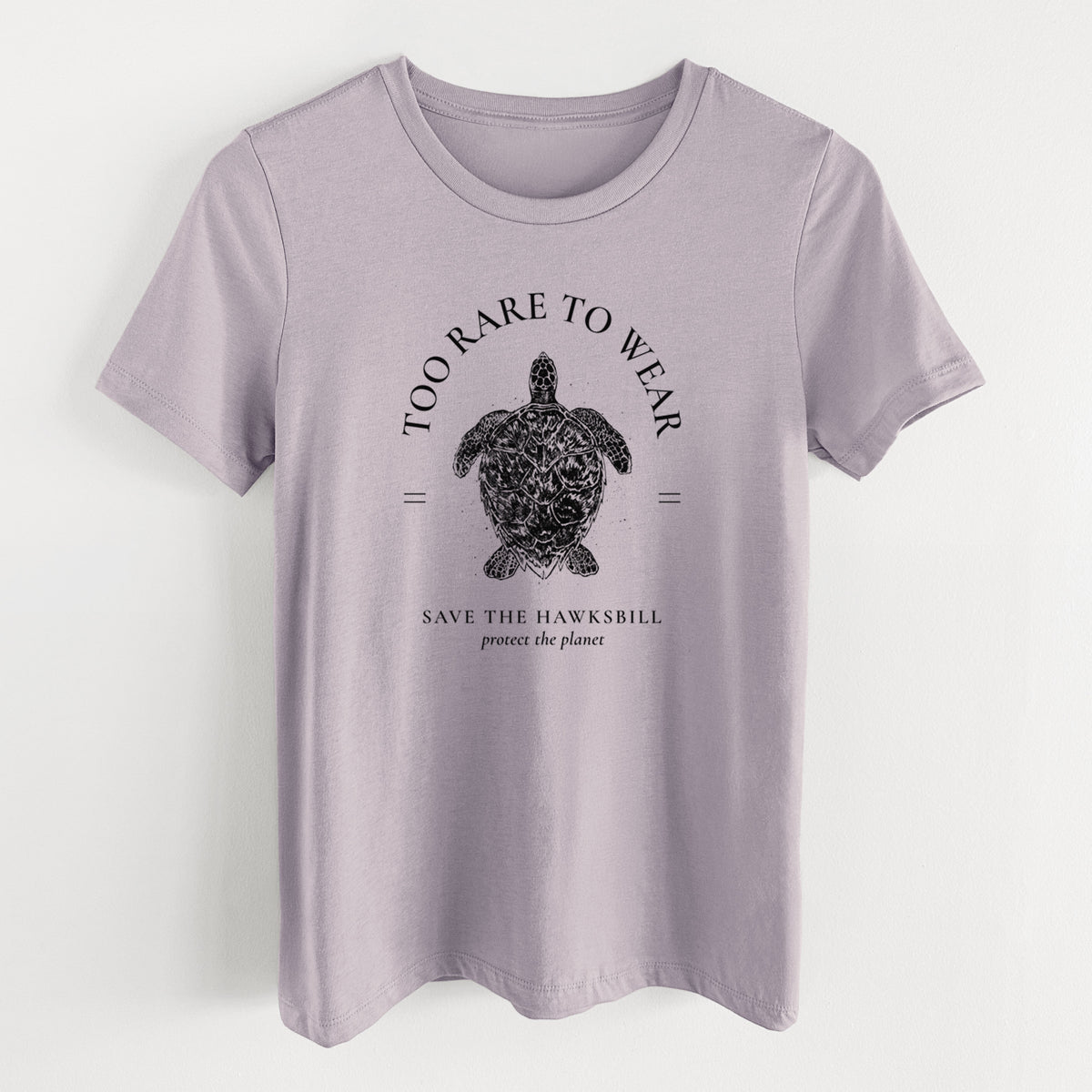 Light violet women's relaxed fit cotton t-shirt laid flat, printed with a black ink hawksbill sea turtle framed by the words Too Rare to Wear, Save the Hawksbill.