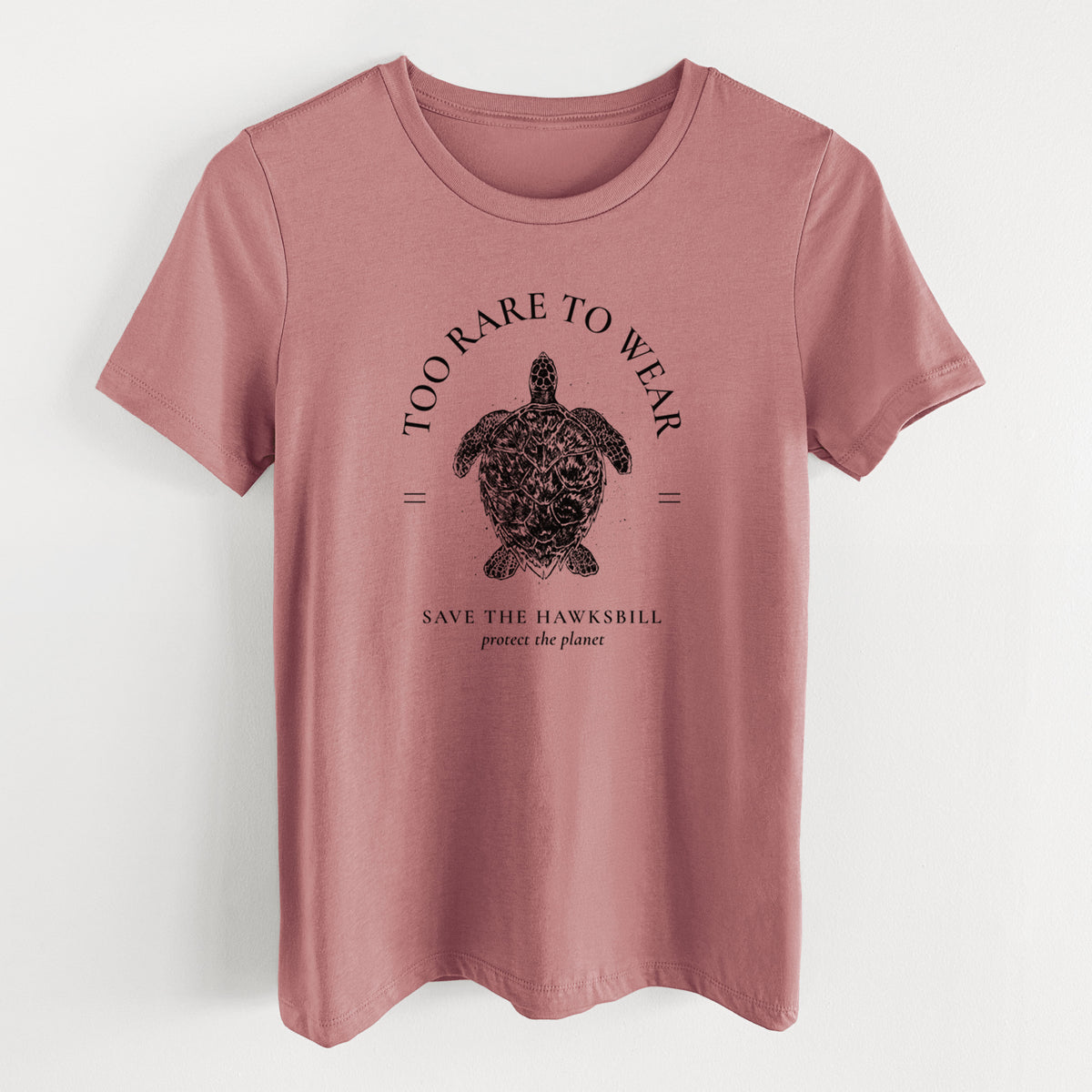 Mauve pink women's relaxed fit cotton t-shirt laid flat, printed with a black ink hawksbill sea turtle framed by the words Too Rare to Wear, Save the Hawksbill.