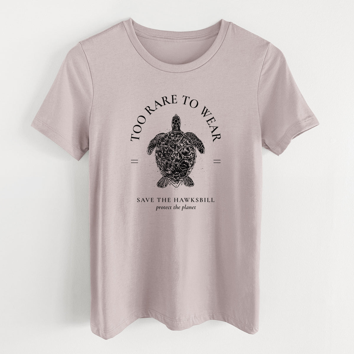 Pink gravel women's relaxed fit cotton t-shirt laid flat, printed with a black ink hawksbill sea turtle framed by the words Too Rare to Wear, Save the Hawksbill.