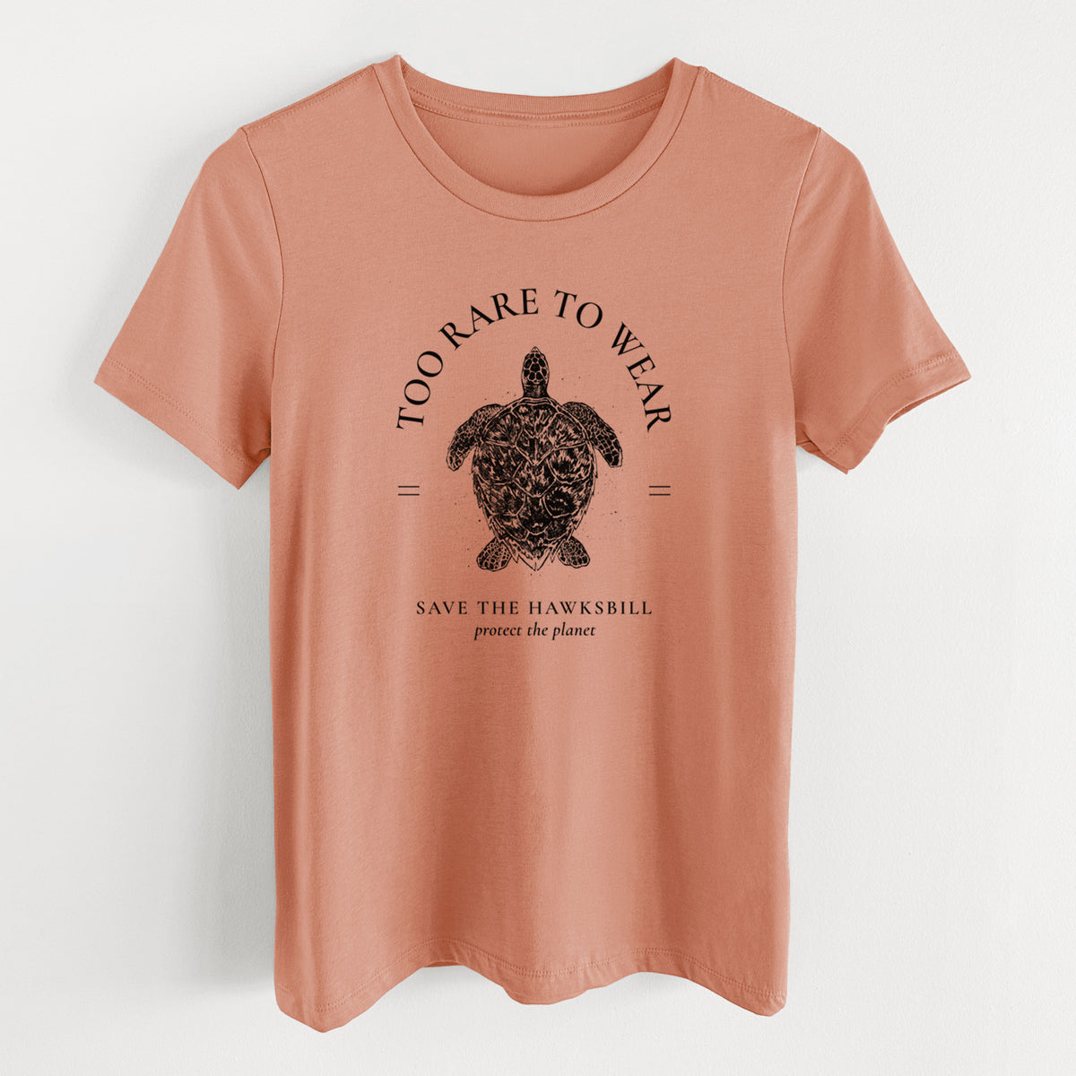 Terracotta orange women's relaxed fit cotton t-shirt laid flat, printed with a black ink hawksbill sea turtle framed by the words Too Rare to Wear, Save the Hawksbill.