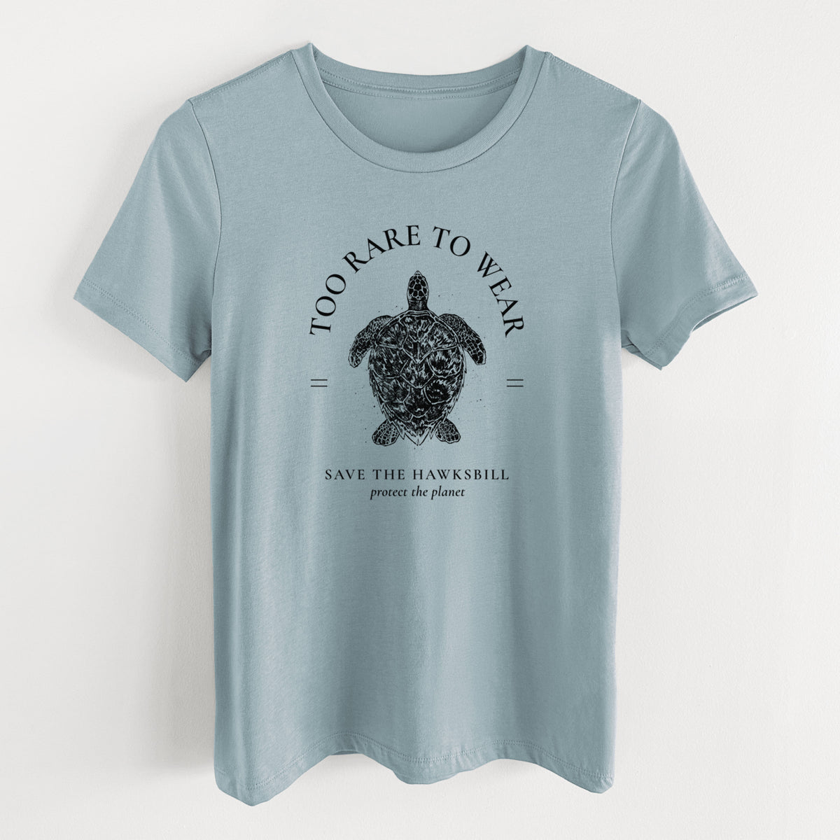Vintage denim women's relaxed fit cotton t-shirt laid flat, printed with a black ink hawksbill sea turtle framed by the words Too Rare to Wear, Save the Hawksbill.