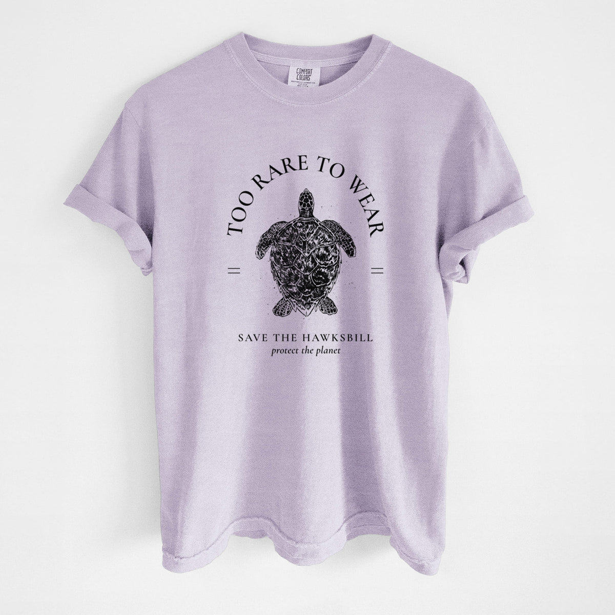 Orchid purple Comfort Colors t-shirt laid flat, printed with a black ink hawksbill sea turtle framed by the words Too Rare to Wear, Save the Hawksbill.