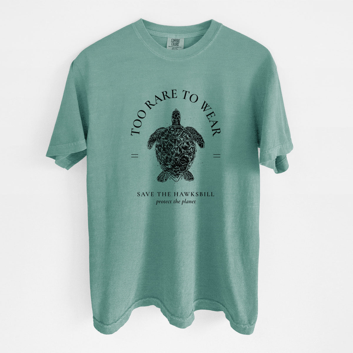 Reef green Comfort Colors t-shirt laid flat, printed with a black ink hawksbill sea turtle framed by the words Too Rare to Wear, Save the Hawksbill.
