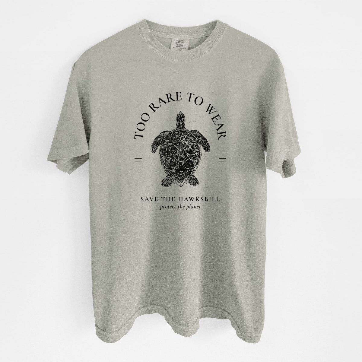 Sandstone beige Comfort Colors t-shirt laid flat, printed with a black ink hawksbill sea turtle framed by the words Too Rare to Wear, Save the Hawksbill.
