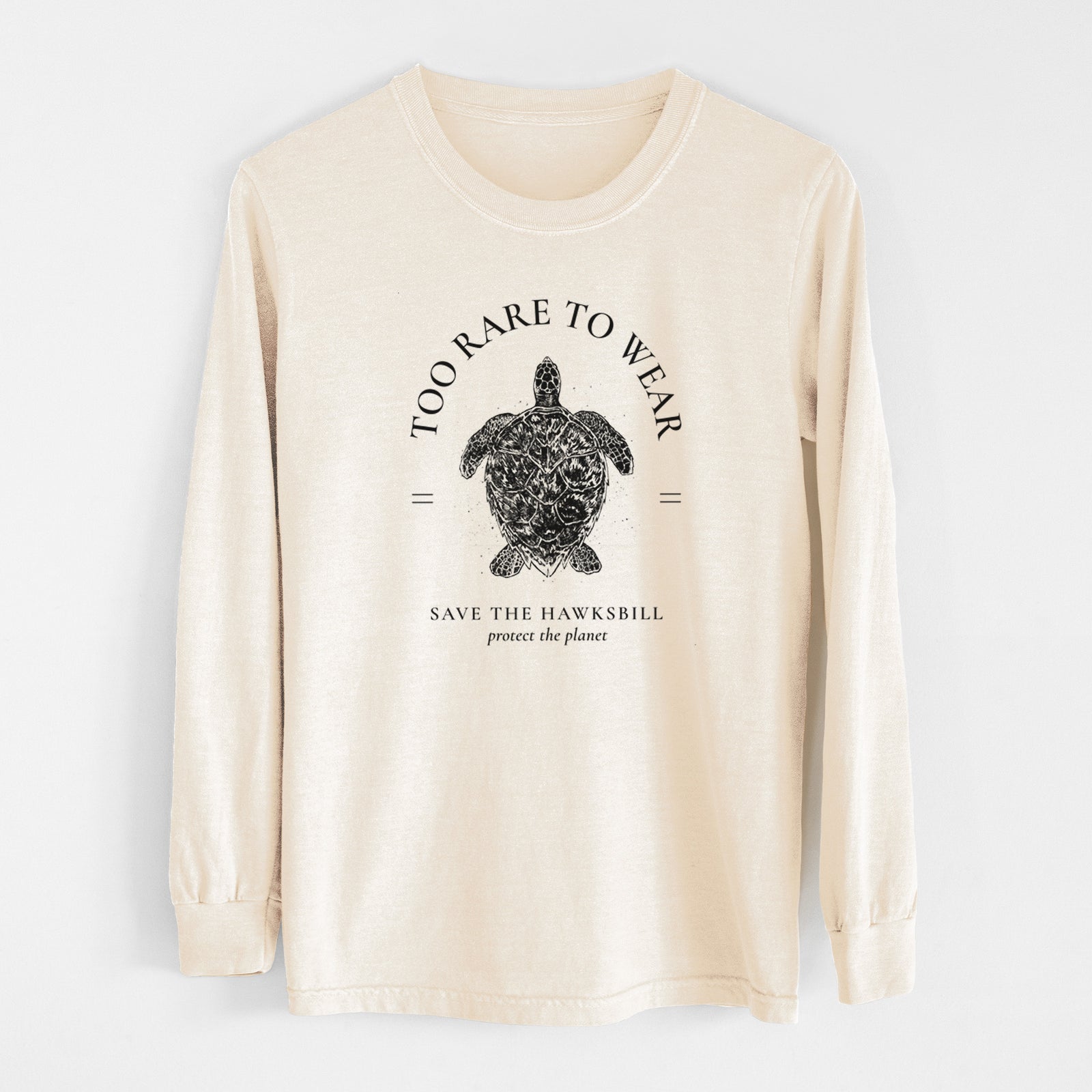 Ivory Comfort Colors long sleeve shirt laid flat, printed with a black ink hawksbill sea turtle framed by the words Too Rare to Wear, Save the Hawksbill.