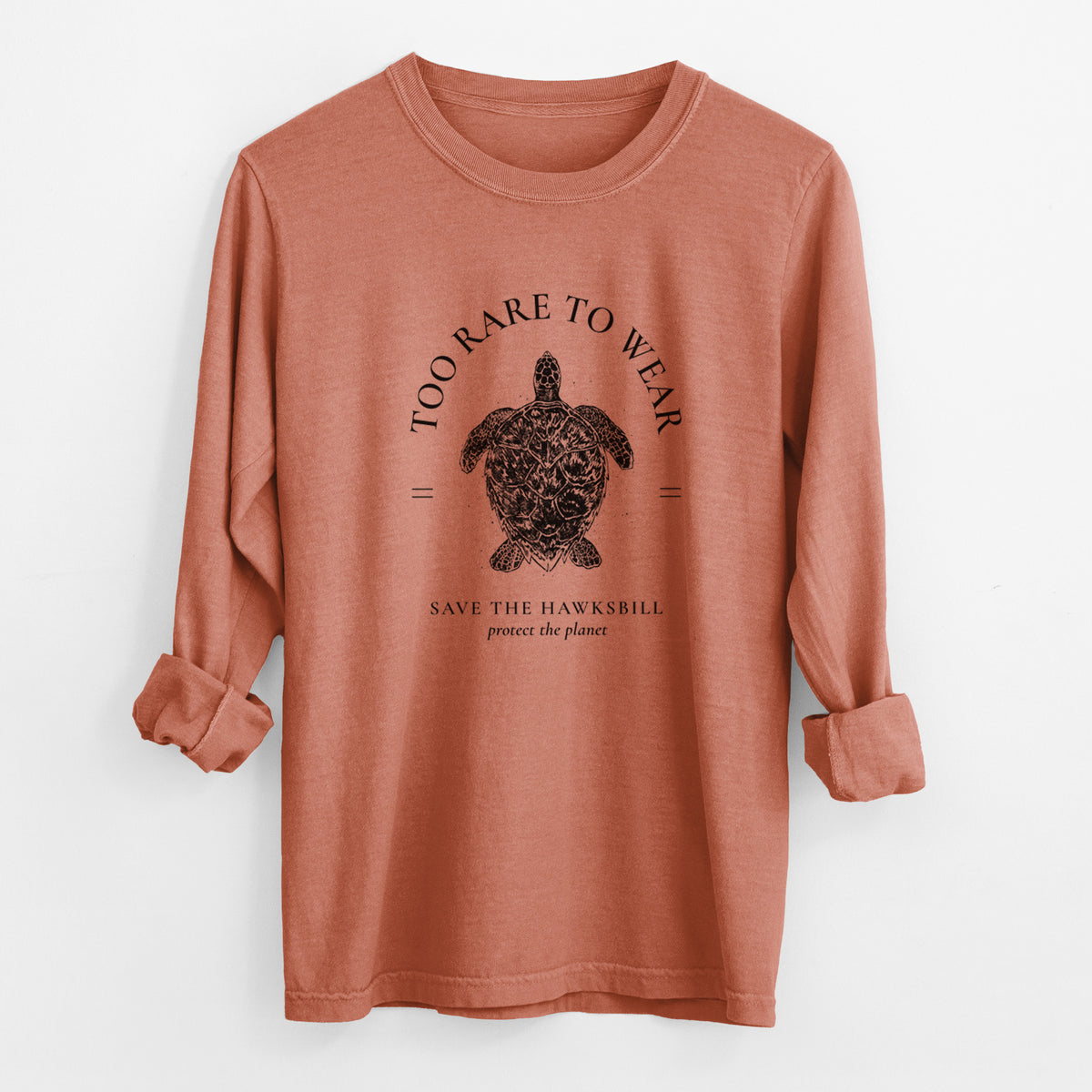 Yam burnt orange Comfort Colors long sleeve shirt laid flat with the cuffs rolled, printed with a black ink hawksbill sea turtle framed by the words Too Rare to Wear, Save the Hawksbill.