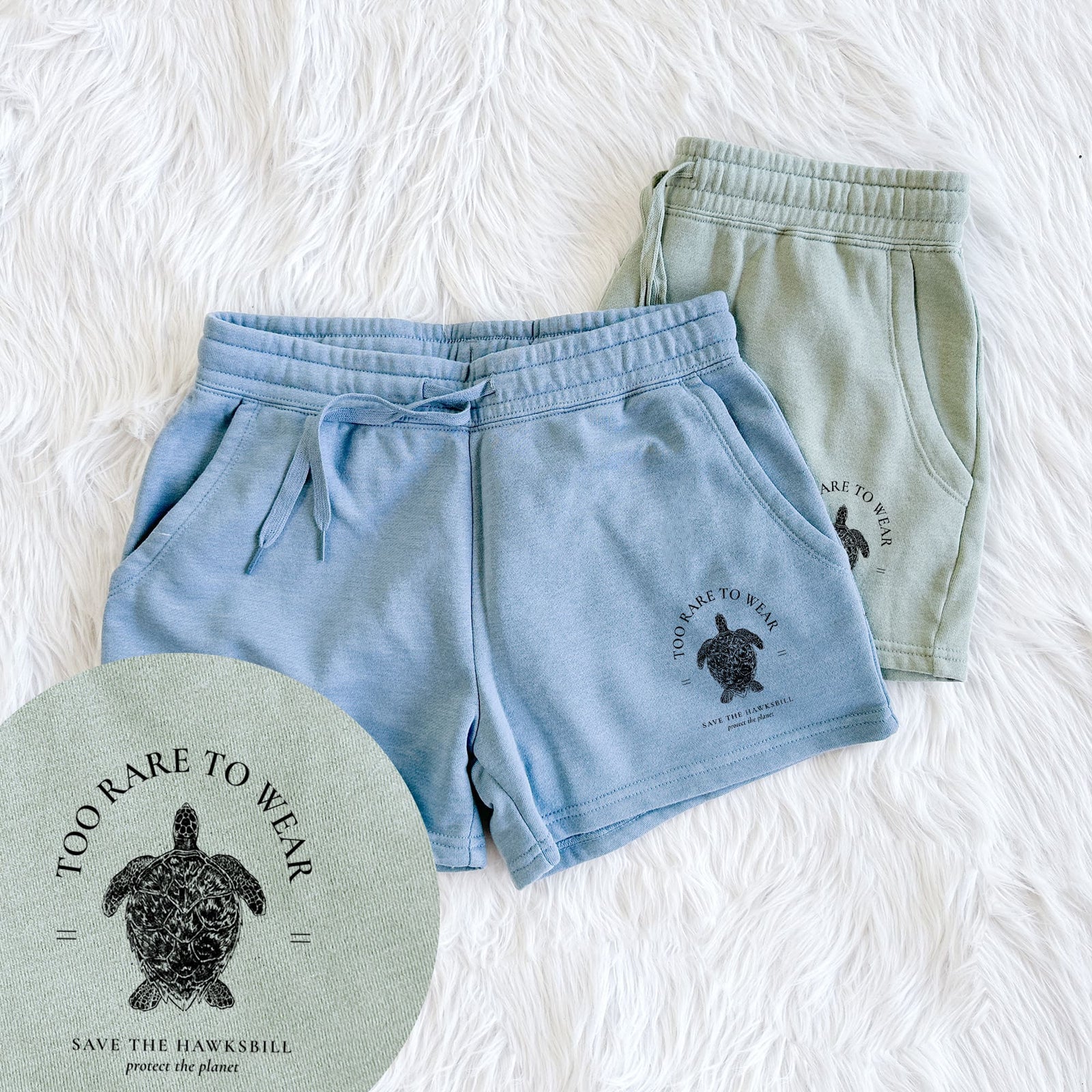 Two pairs of Cali Wave shorts in different colors printed with a black ink hawksbill sea turtle framed by the words Too Rare to Wear, Save the Hawksbill, with a close-up of the print.
