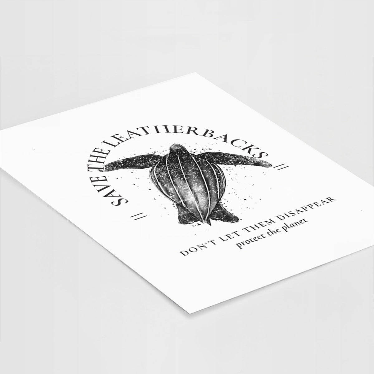 Art print of a black ink leatherback sea turtle framed by the words Save the Leatherbacks, Don't Let Them Disappear, lying at an angle on a white surface.