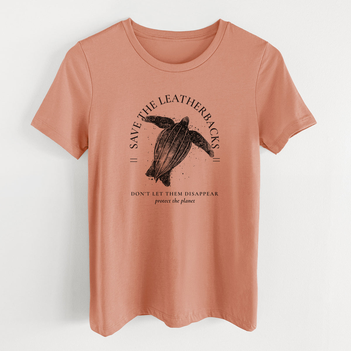 Terracotta orange women's relaxed fit cotton t-shirt laid flat, printed with a black ink leatherback sea turtle framed by the words Save the Leatherbacks, Don't Let Them Disappear.