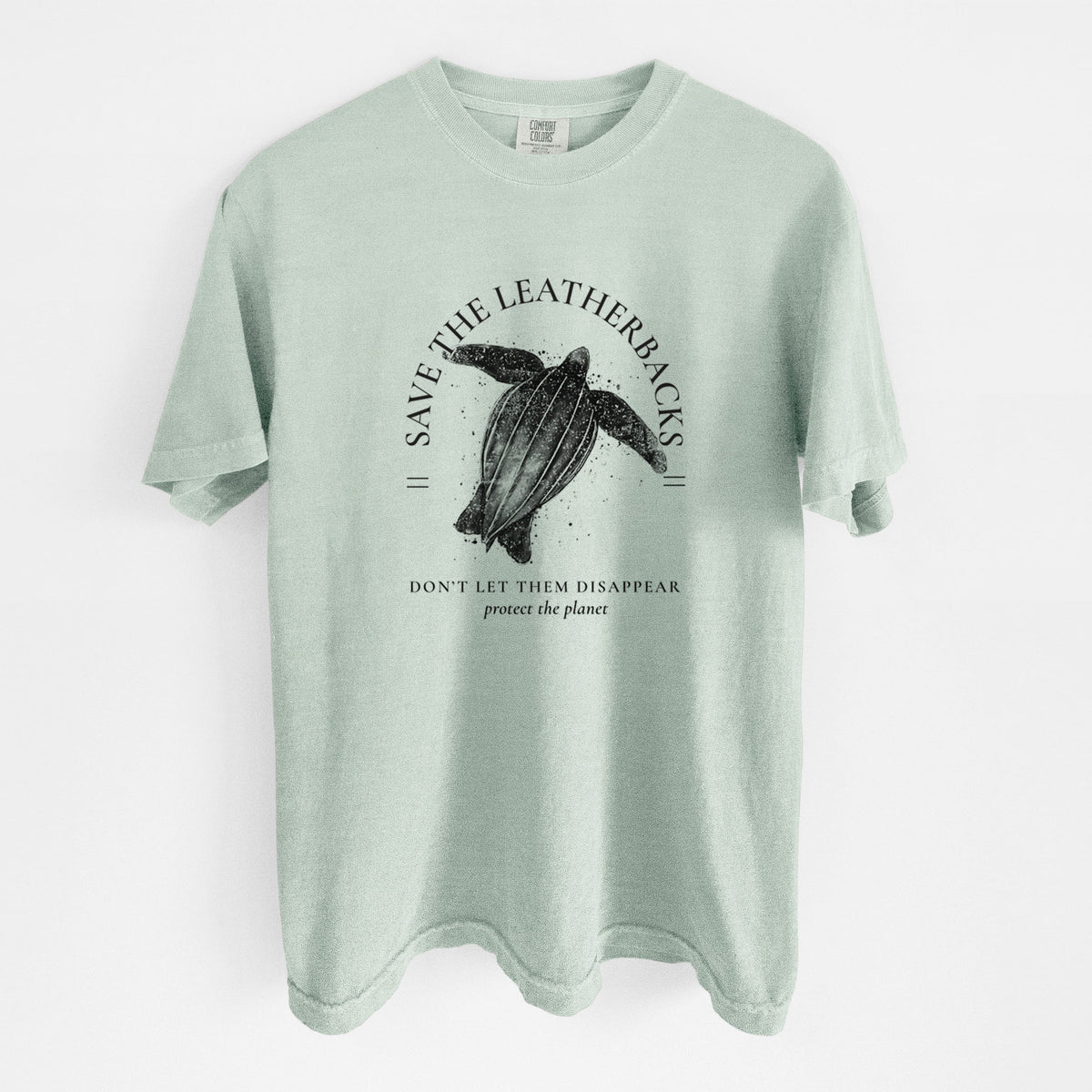 Bay green Comfort Colors t-shirt laid flat, printed with a black ink leatherback sea turtle framed by the words Save the Leatherbacks, Don't Let Them Disappear.