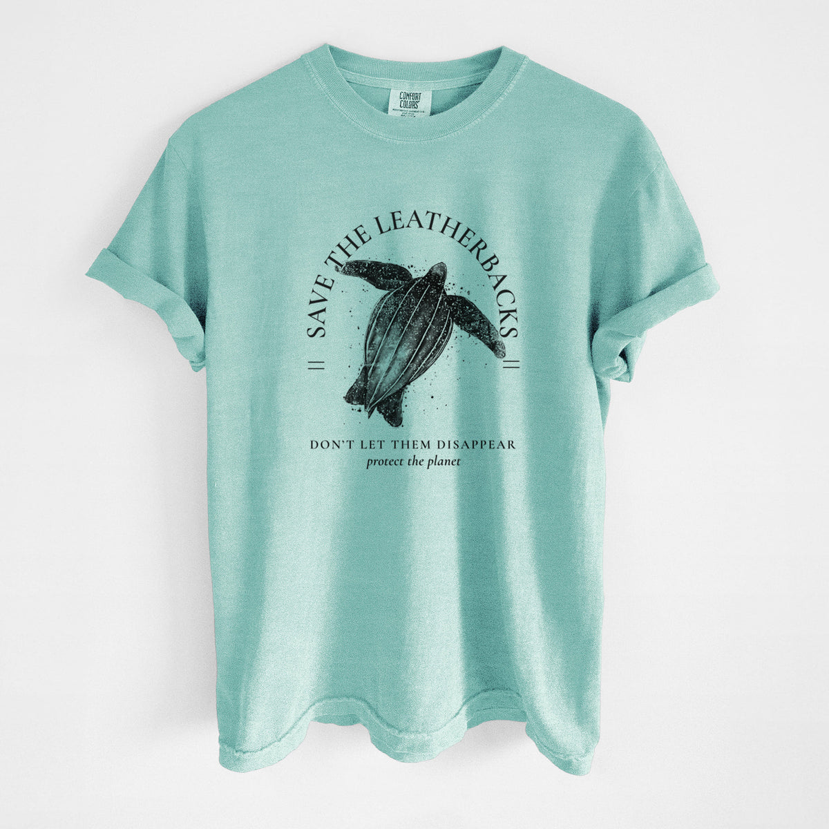 Chalky mint Comfort Colors t-shirt laid flat, printed with a black ink leatherback sea turtle framed by the words Save the Leatherbacks, Don't Let Them Disappear.