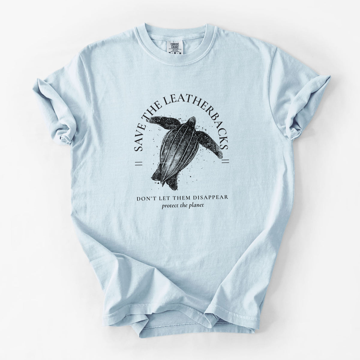 Chambray blue Comfort Colors t-shirt laid flat, printed with a black ink leatherback sea turtle framed by the words Save the Leatherbacks, Don't Let Them Disappear.