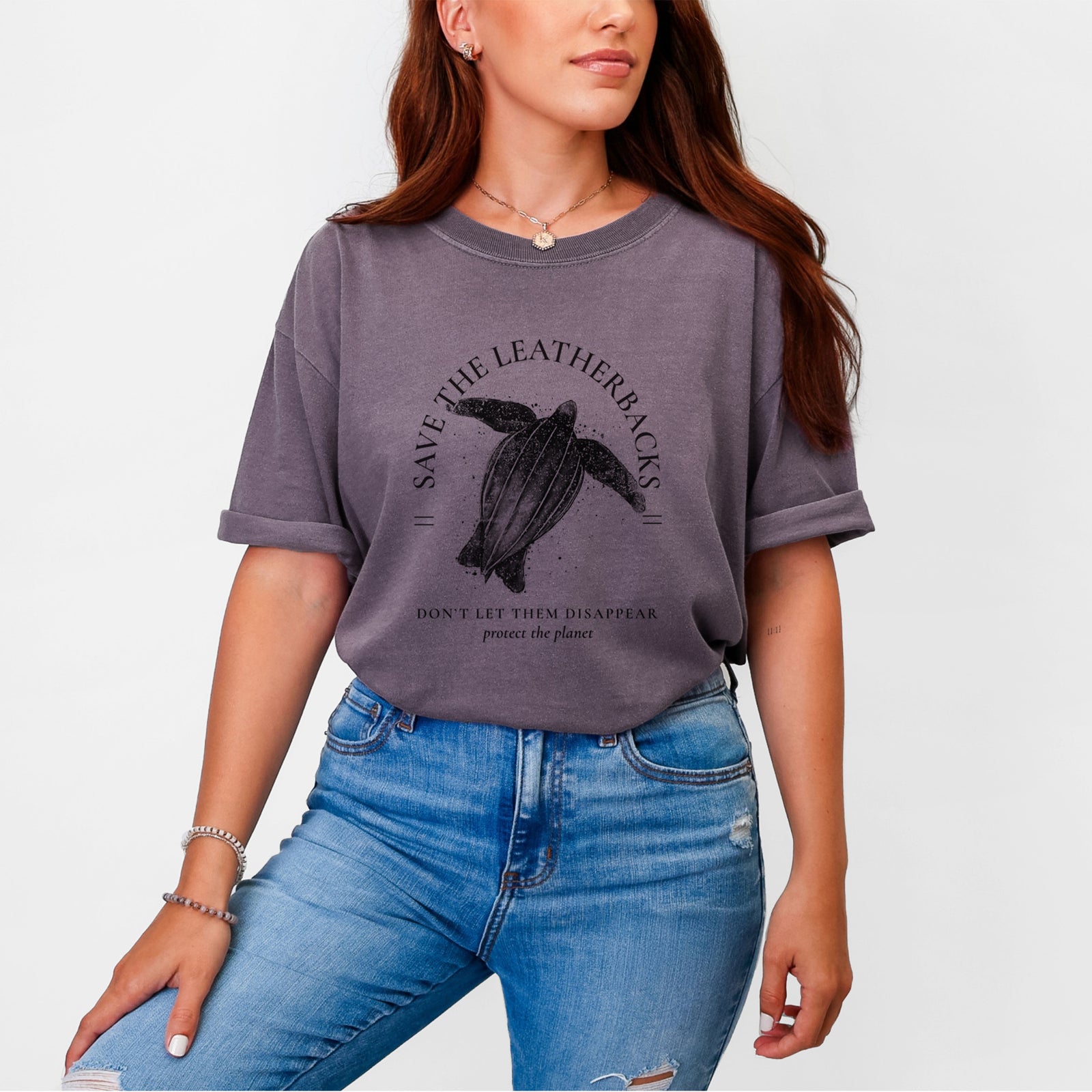 Blue jean Comfort Colors t-shirt laid flat, printed with a black ink leatherback sea turtle framed by the words Save the Leatherbacks, Don't Let Them Disappear.