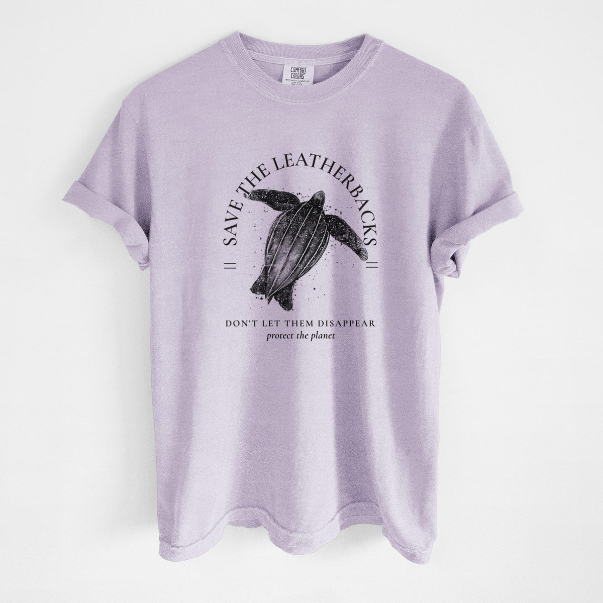 Orchid purple Comfort Colors t-shirt laid flat, printed with a black ink leatherback sea turtle framed by the words Save the Leatherbacks, Don't Let Them Disappear.