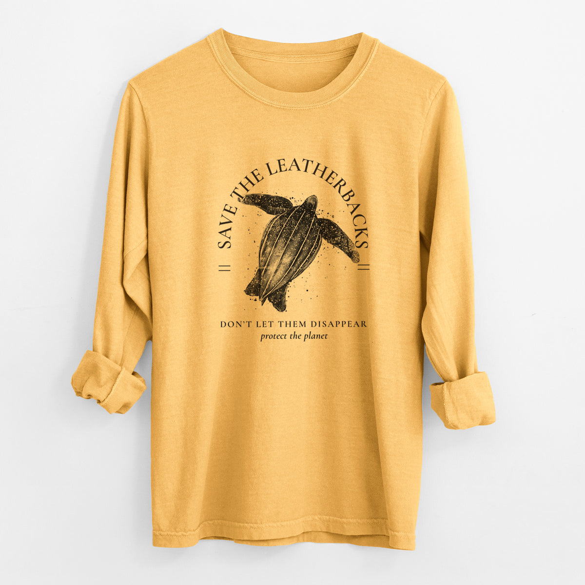 Golden wheat yellow Comfort Colors long sleeve shirt laid flat with the cuffs rolled, printed with a black ink leatherback sea turtle framed by the words Save the Leatherbacks, Don't Let Them Disappear.