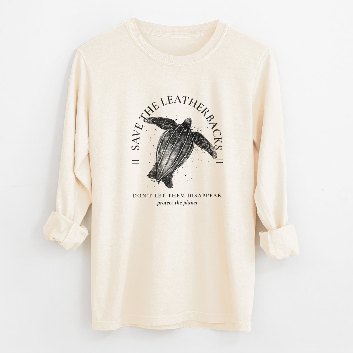 Ivory Comfort Colors long sleeve shirt laid flat with the cuffs rolled, printed with a black ink leatherback sea turtle framed by the words Save the Leatherbacks, Don't Let Them Disappear.
