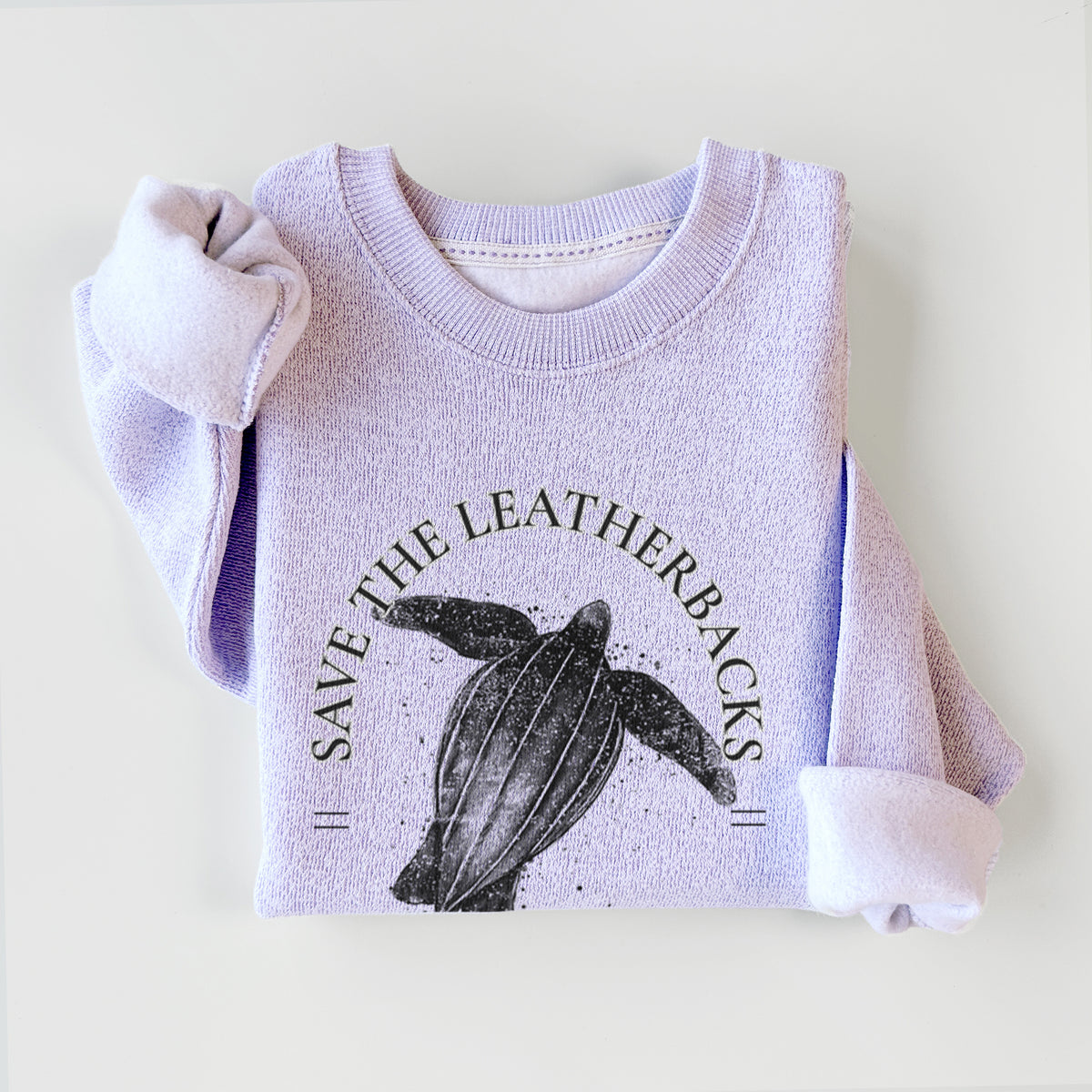 Ice purple knit sweatshirt printed with a black ink leatherback sea turtle framed by the words Save the Leatherbacks, Don't Let Them Disappear, styled flat.