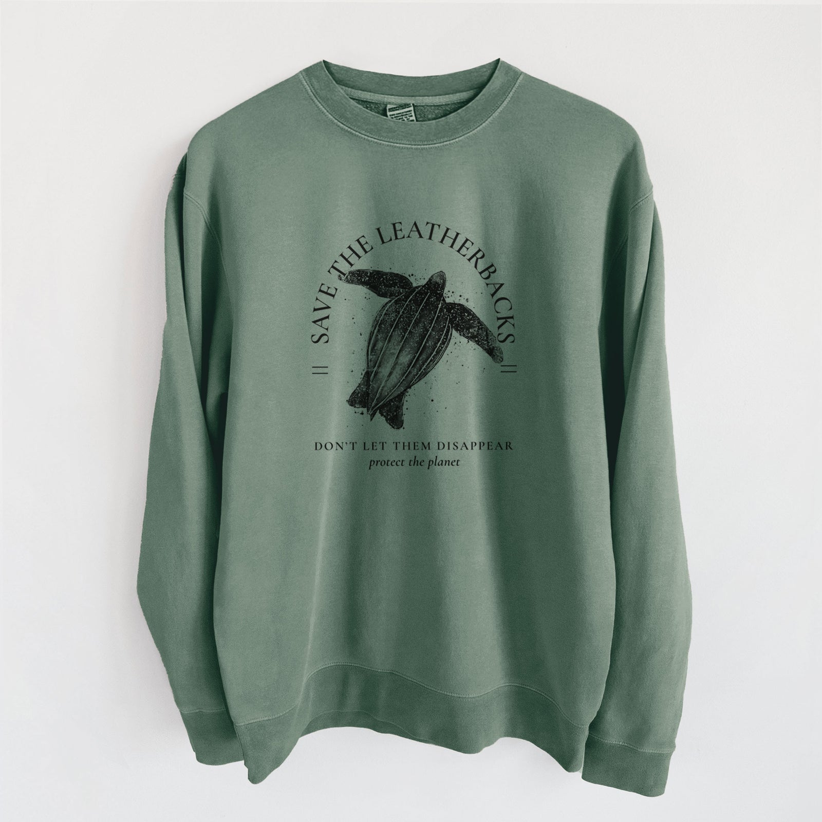 Alpine green pigment dyed crewneck sweatshirt laid flat, printed with a black ink leatherback sea turtle framed by the words Save the Leatherbacks, Don't Let Them Disappear.