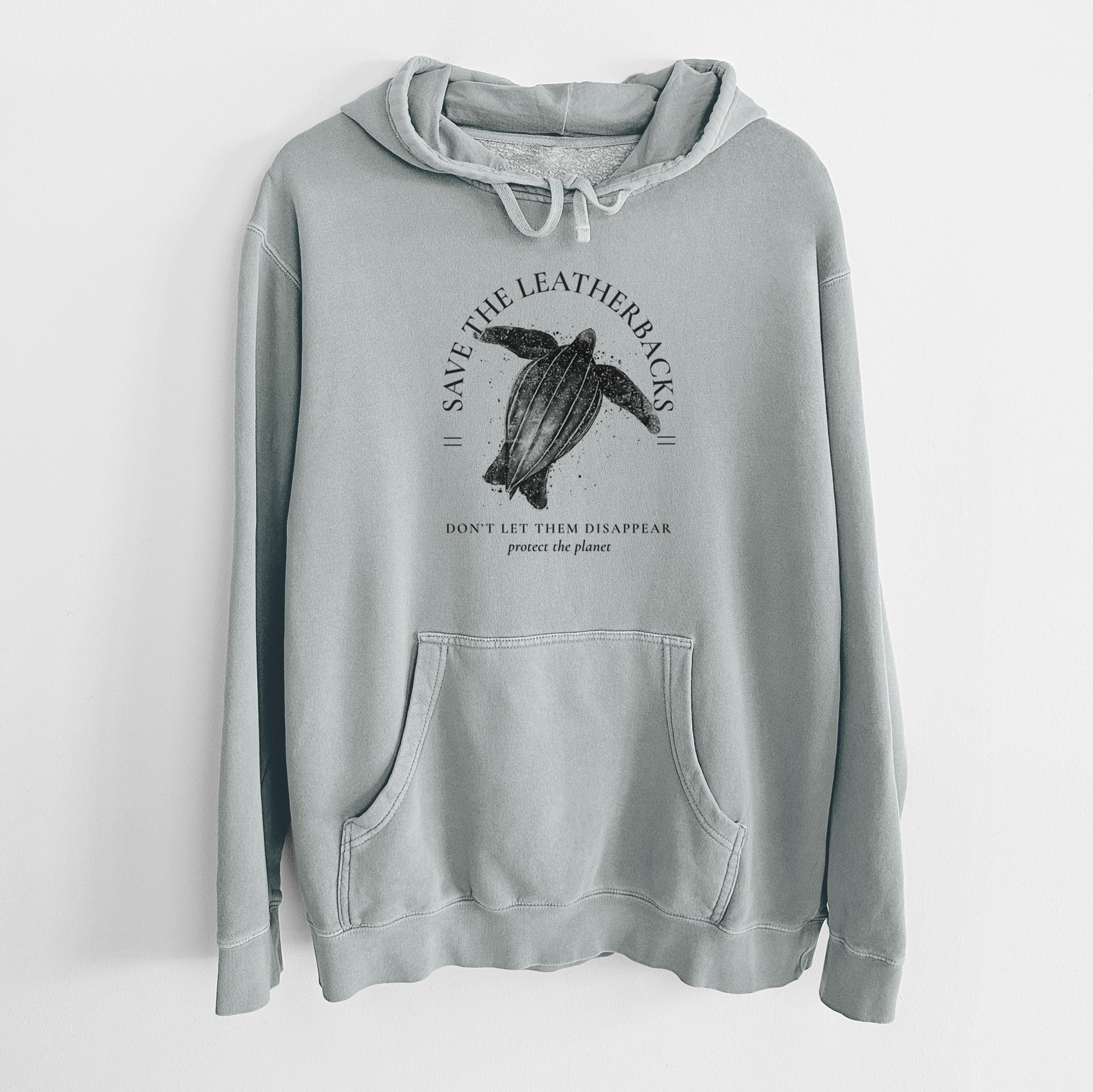 Sage green pigment dyed hoodie laid flat, printed with a black ink leatherback sea turtle framed by the words Save the Leatherbacks, Don't Let Them Disappear.