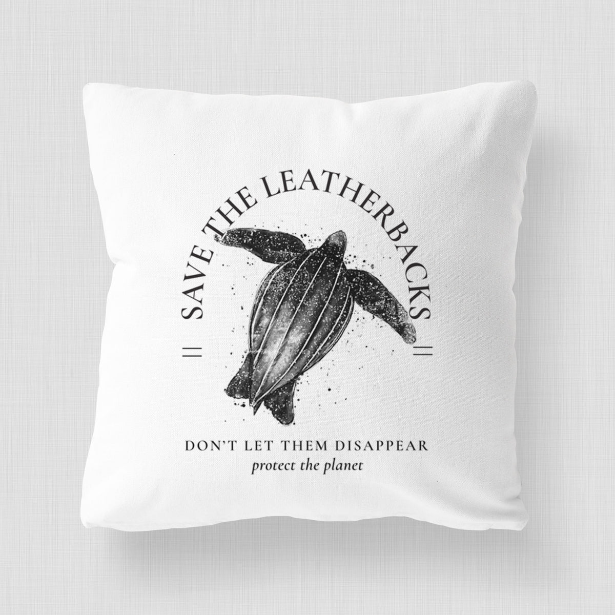 White pillow cover printed with a black ink leatherback sea turtle framed by the words Save the Leatherbacks, Don't Let Them Disappear.