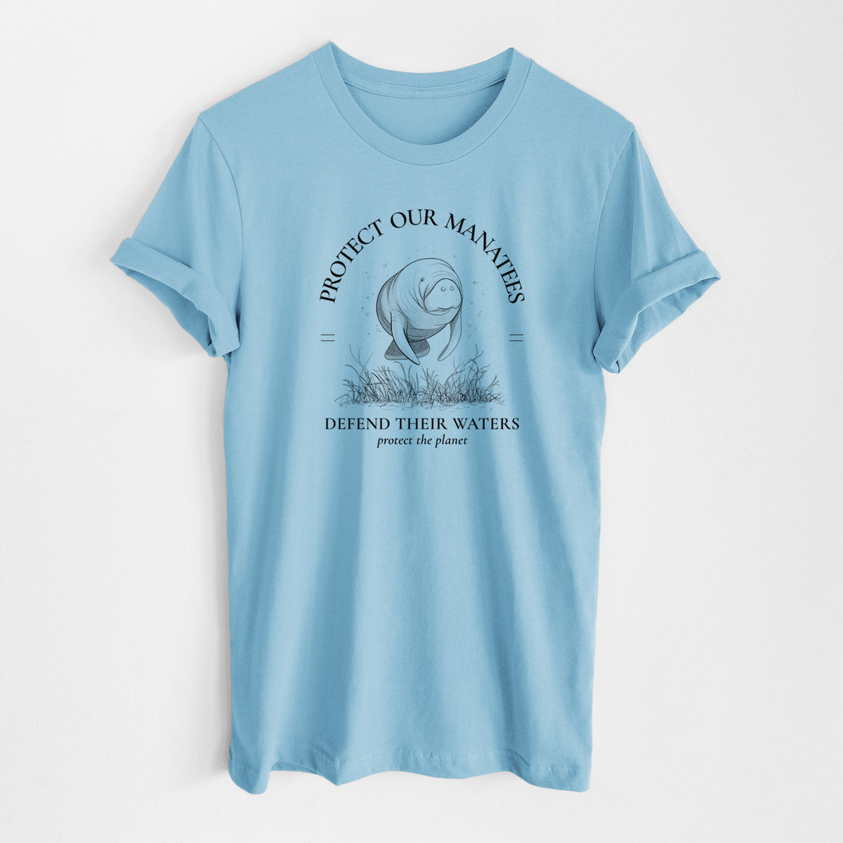 Ocean blue lightweight cotton t-shirt laid flat, printed with a black ink illustration of a manatee among seagrass, framed by the words Protect Our Manatees, Defend Their Waters, Protect the Planet.