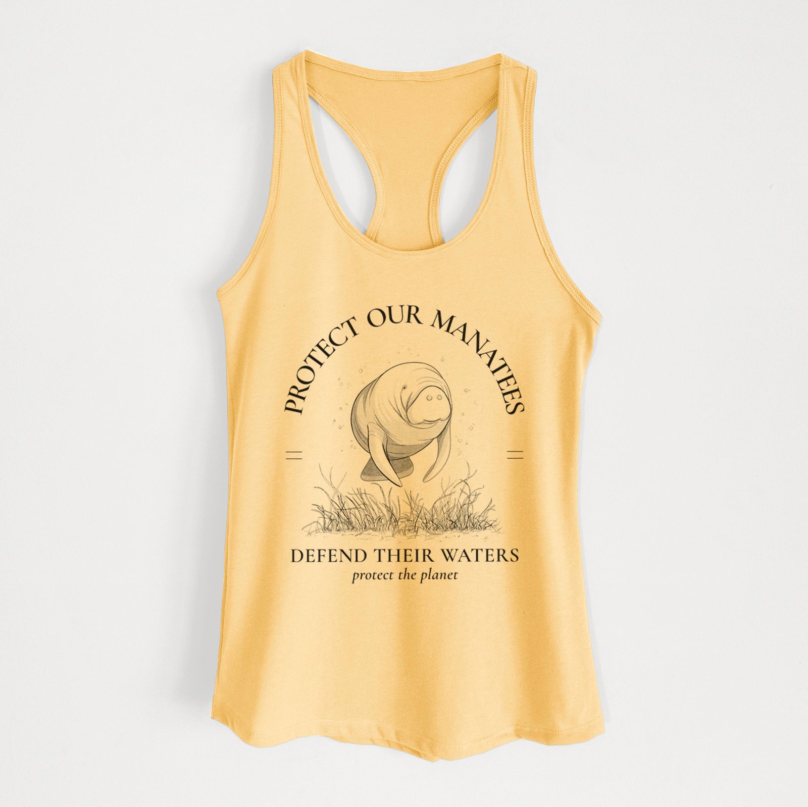Banana cream women's racerback tank top laid flat, printed with a black ink illustration of a manatee among seagrass, framed by the words Protect Our Manatees, Defend Their Waters, Protect the Planet.