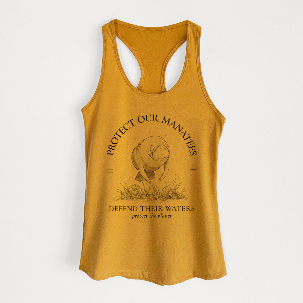 Gold women's racerback tank top laid flat, printed with a black ink illustration of a manatee among seagrass, framed by the words Protect Our Manatees, Defend Their Waters, Protect the Planet.