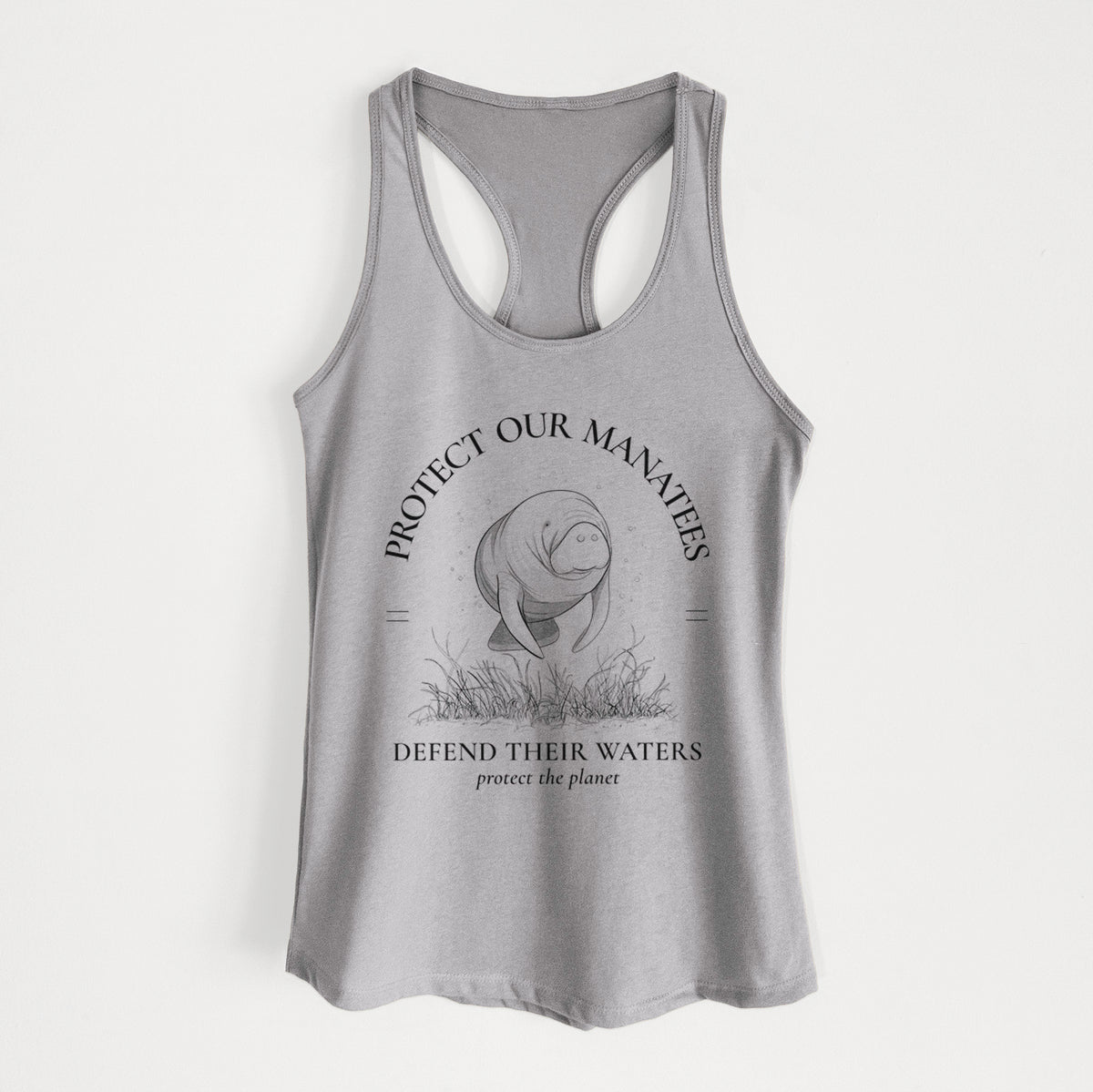 Heather grey women's racerback tank top laid flat, printed with a black ink illustration of a manatee among seagrass, framed by the words Protect Our Manatees, Defend Their Waters, Protect the Planet.