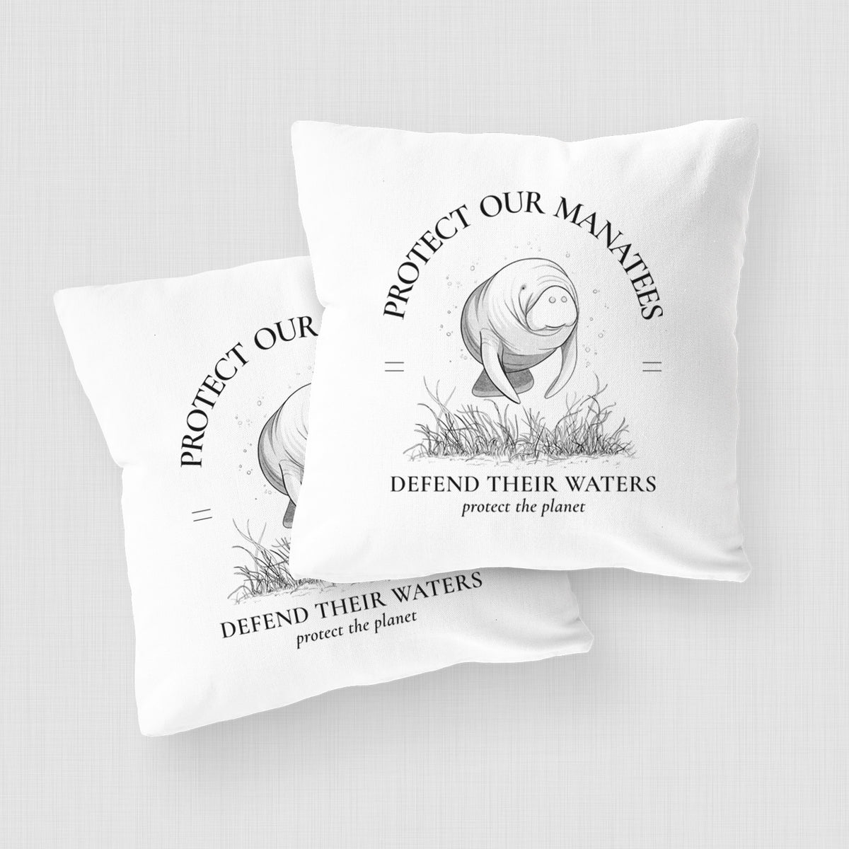 White pillow cover printed with a black ink illustration of a manatee among seagrass, framed by the words Protect Our Manatees, Defend Their Waters, Protect the Planet, on a woven chair.