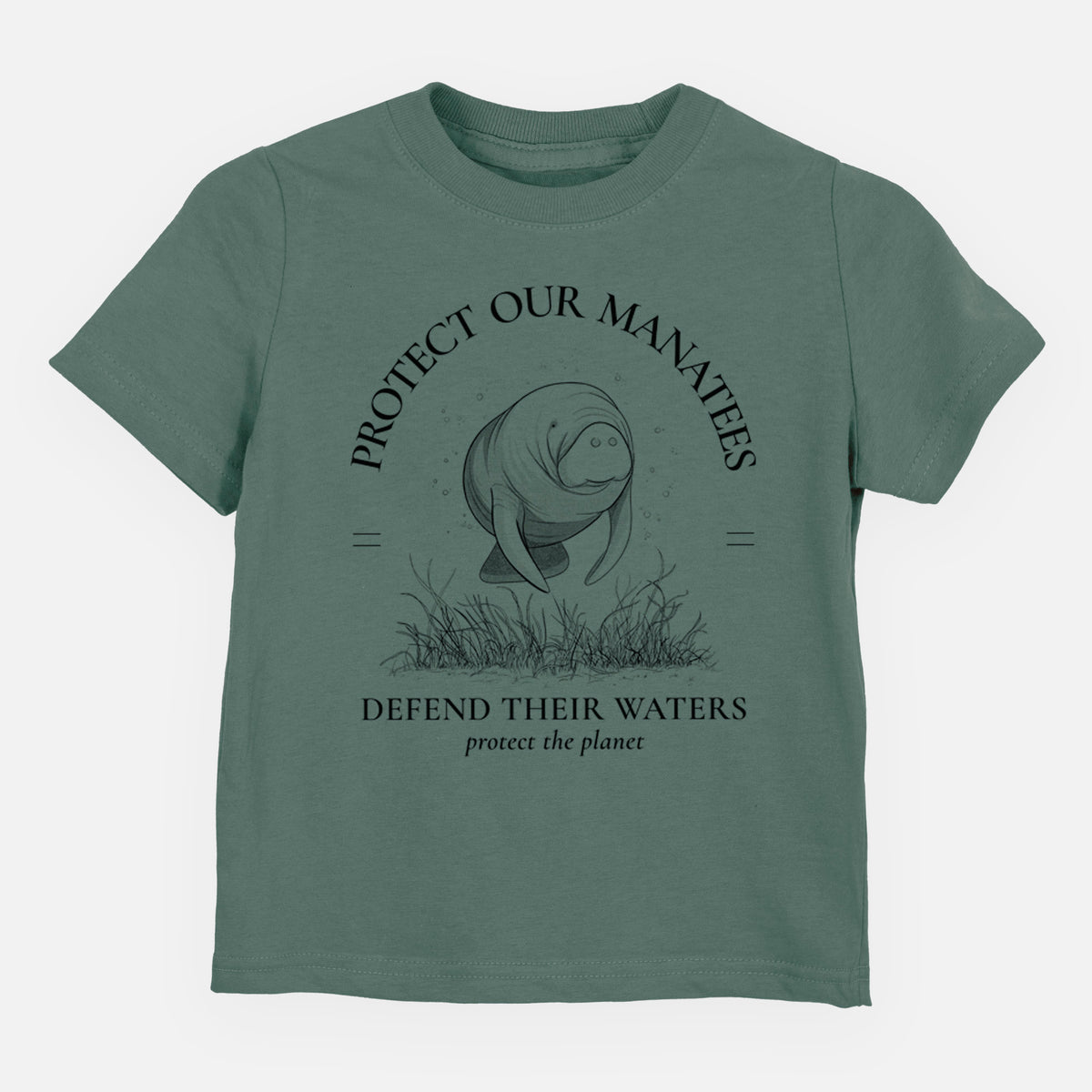 Basil green toddler t-shirt laid flat, printed with a black ink illustration of a manatee among seagrass, framed by the words Protect Our Manatees, Defend Their Waters, Protect the Planet.