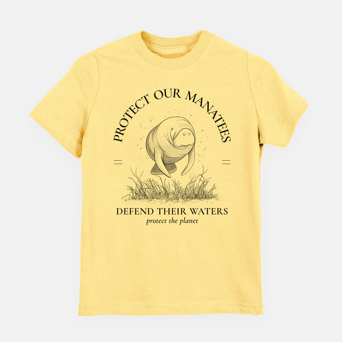 Butter yellow youth t-shirt laid flat, printed with a black ink illustration of a manatee among seagrass, framed by the words Protect Our Manatees, Defend Their Waters, Protect the Planet.