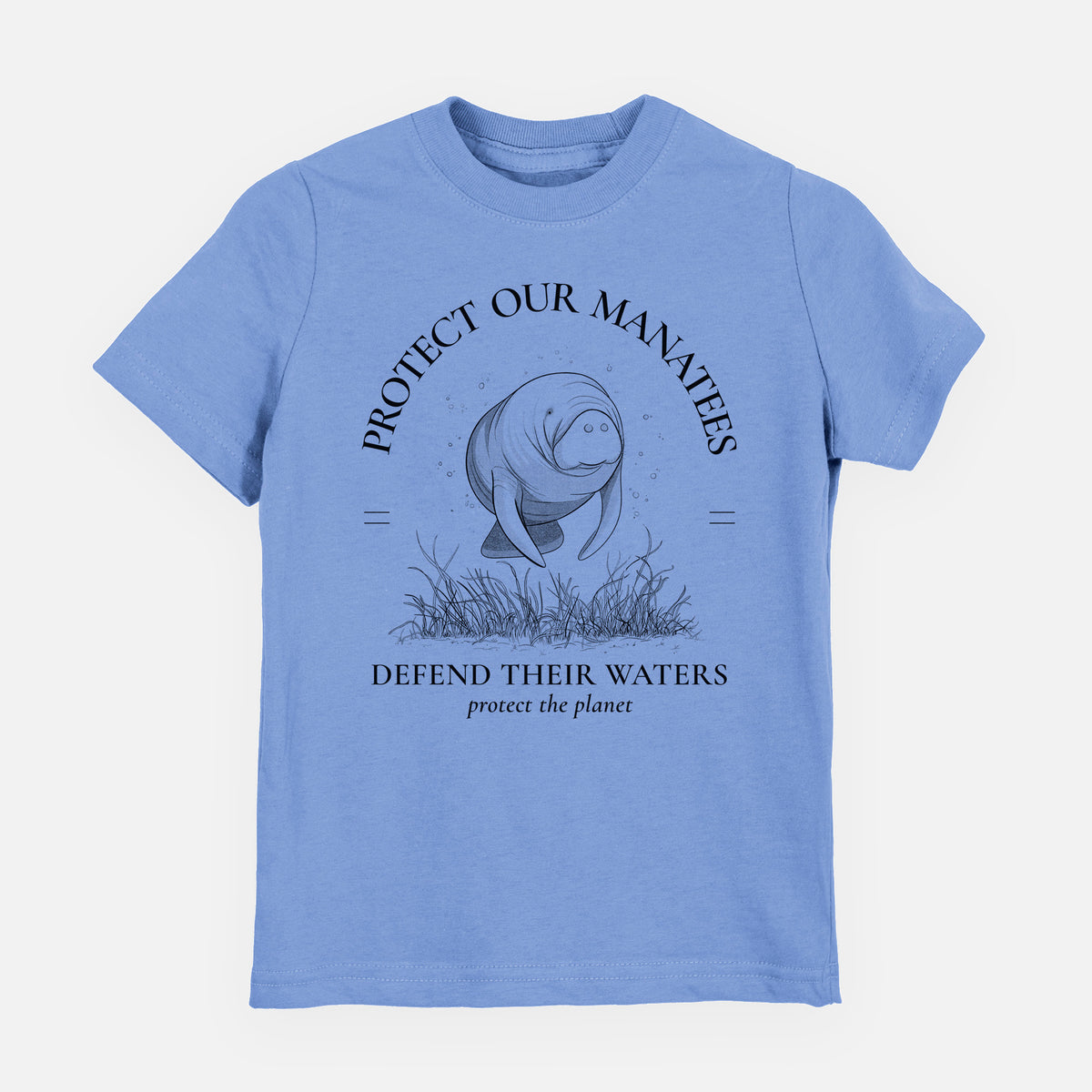 Carolina blue youth t-shirt laid flat, printed with a black ink illustration of a manatee among seagrass, framed by the words Protect Our Manatees, Defend Their Waters, Protect the Planet.