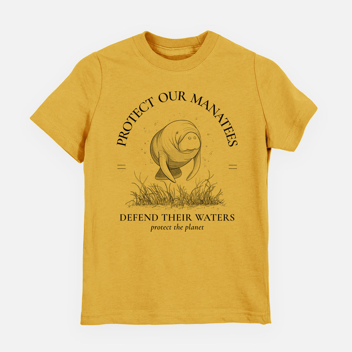 Honeycomb yellow youth t-shirt laid flat, printed with a black ink illustration of a manatee among seagrass, framed by the words Protect Our Manatees, Defend Their Waters, Protect the Planet.