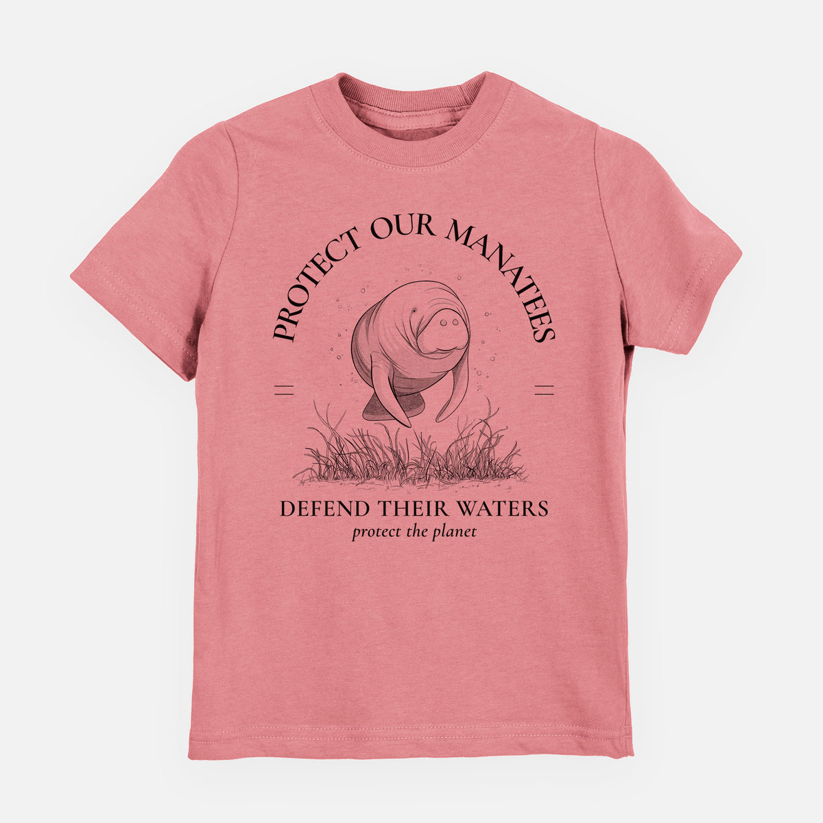 Mauve pink youth t-shirt laid flat, printed with a black ink illustration of a manatee among seagrass, framed by the words Protect Our Manatees, Defend Their Waters, Protect the Planet.