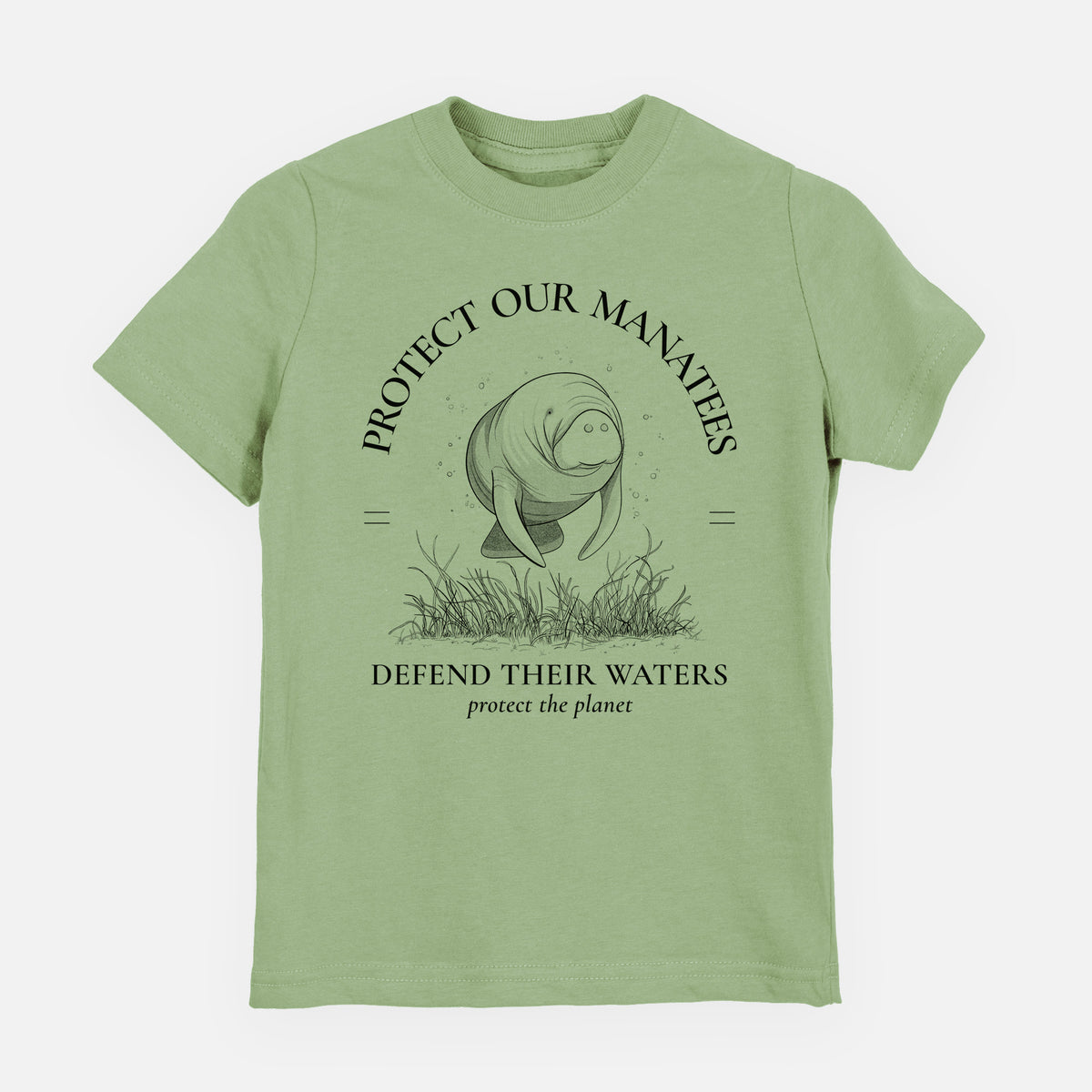 Sage green youth t-shirt laid flat, printed with a black ink illustration of a manatee among seagrass, framed by the words Protect Our Manatees, Defend Their Waters, Protect the Planet.