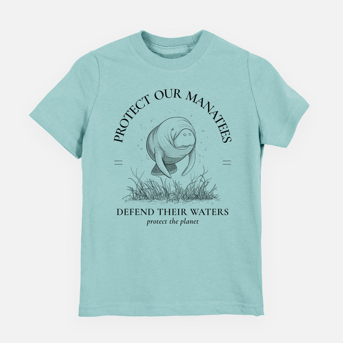 Saltwater youth t-shirt laid flat, printed with a black ink illustration of a manatee among seagrass, framed by the words Protect Our Manatees, Defend Their Waters, Protect the Planet.