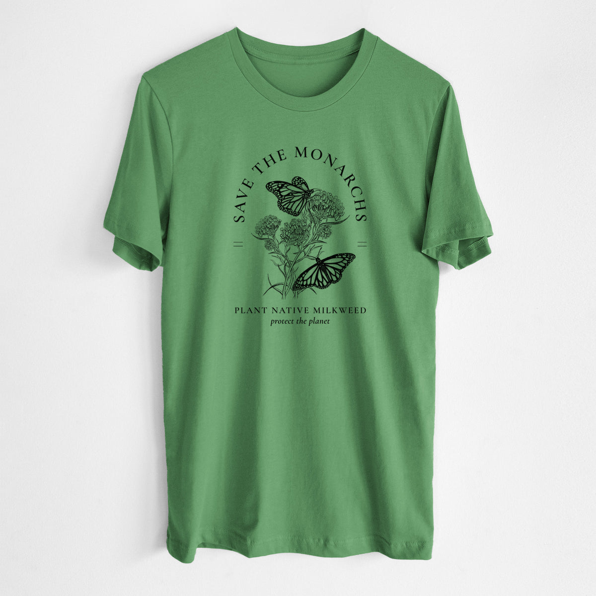 Leaf green lightweight cotton t-shirt laid flat, printed with black ink monarch butterflies on milkweed flowers, framed by the words Save the Monarchs, Plant Native Milkweed.