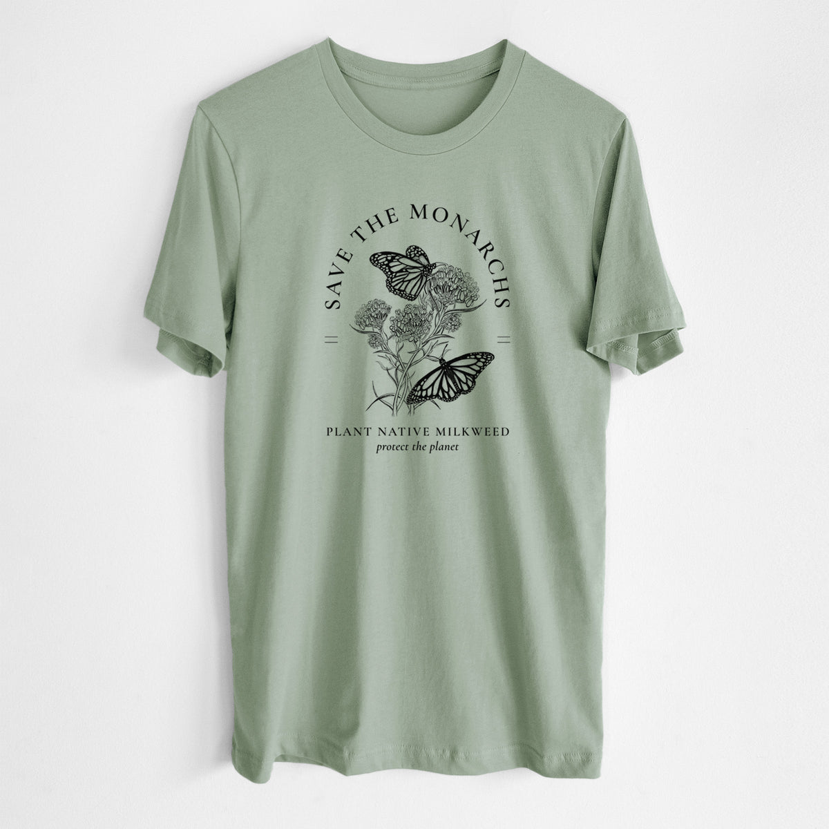 Sage green lightweight cotton t-shirt laid flat, printed with black ink monarch butterflies on milkweed flowers, framed by the words Save the Monarchs, Plant Native Milkweed.