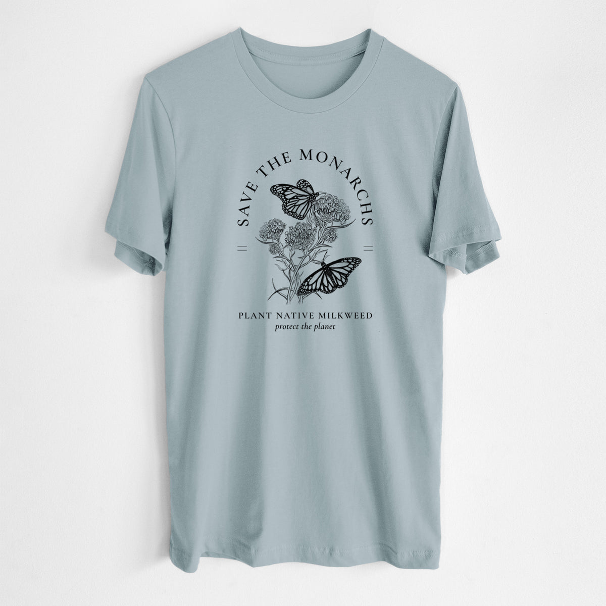 Vintage denim lightweight cotton t-shirt laid flat, printed with black ink monarch butterflies on milkweed flowers, framed by the words Save the Monarchs, Plant Native Milkweed.