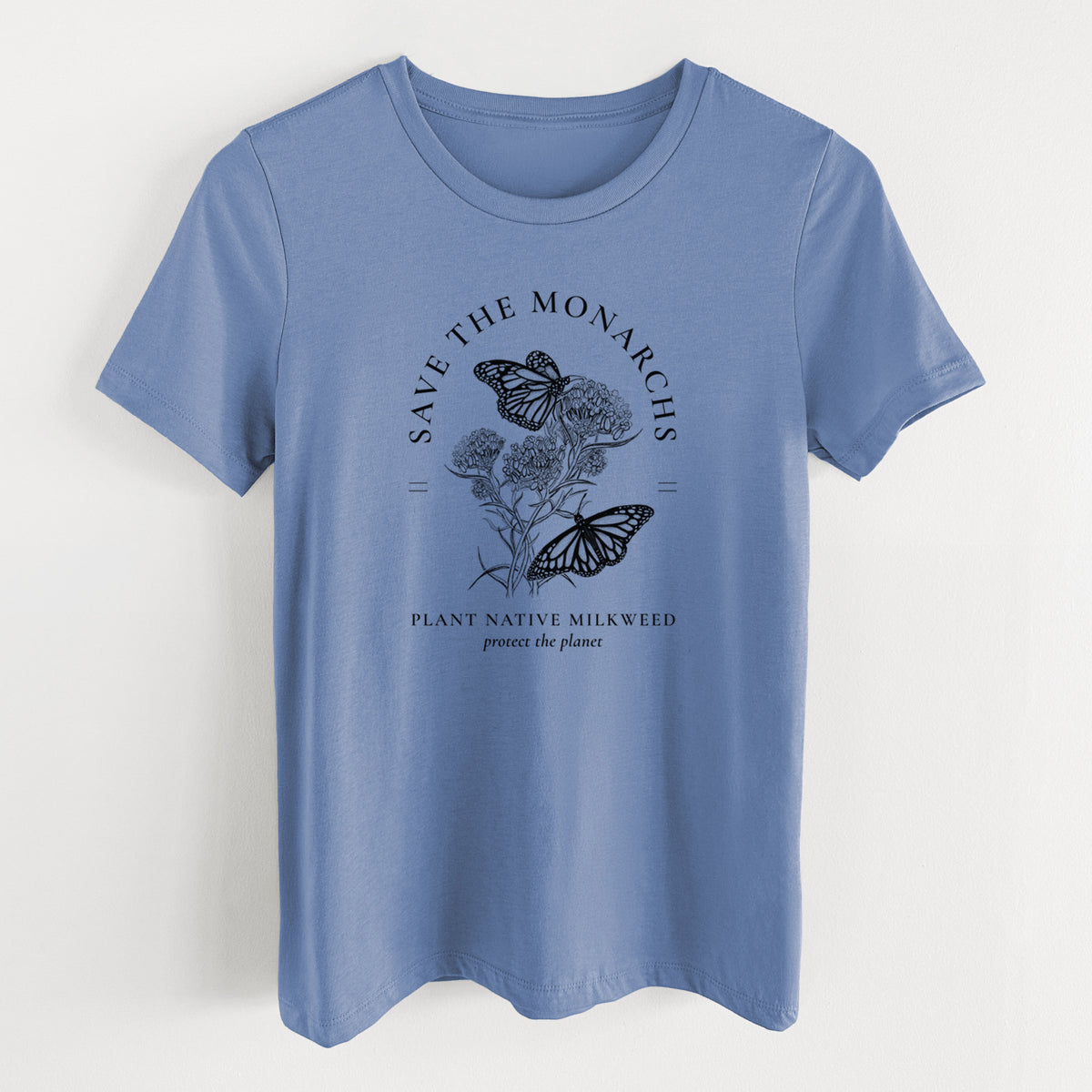 Blue bell women's relaxed fit cotton t-shirt laid flat, printed with black ink monarch butterflies on milkweed flowers, framed by the words Save the Monarchs, Plant Native Milkweed.