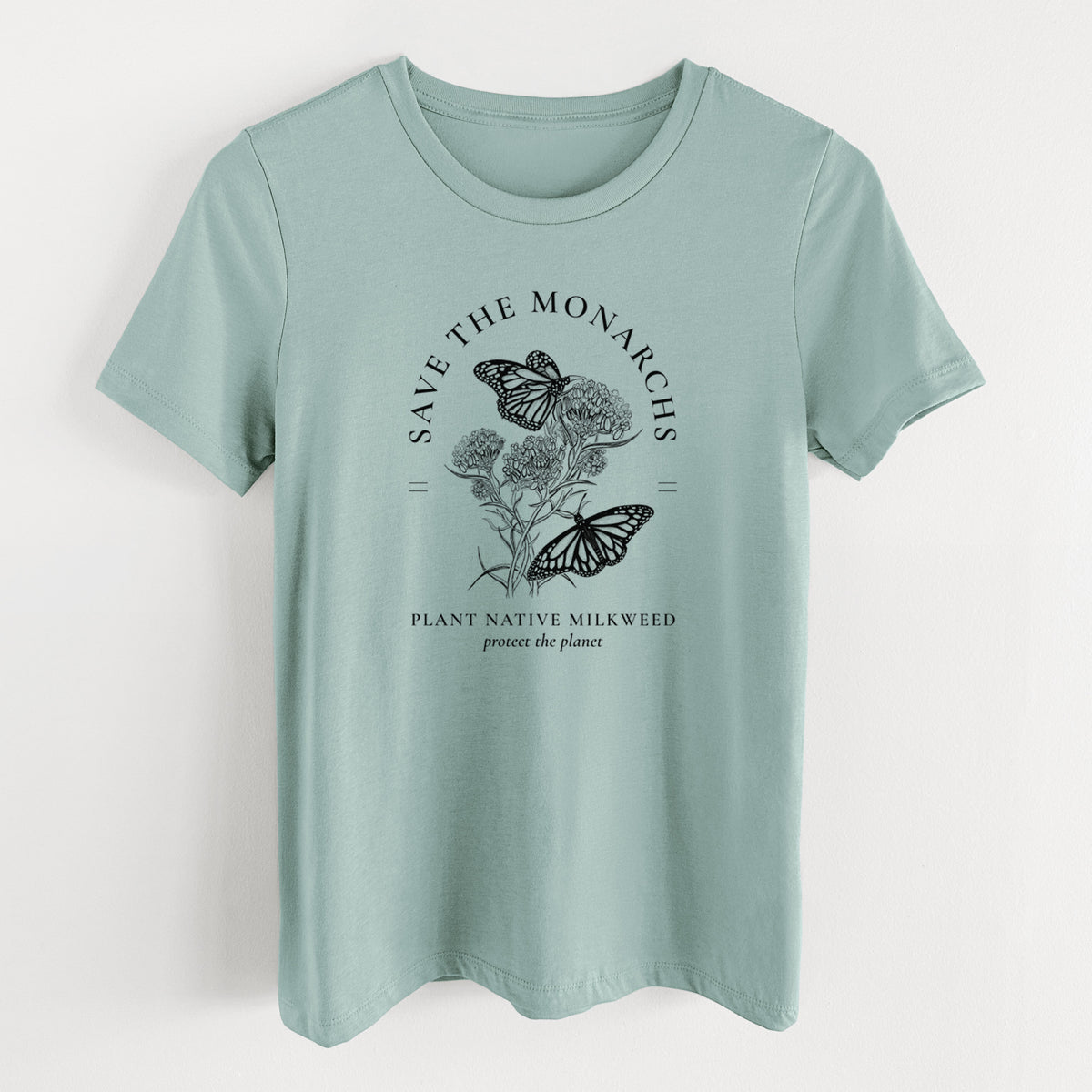 Dusty blue women's relaxed fit cotton t-shirt laid flat, printed with black ink monarch butterflies on milkweed flowers, framed by the words Save the Monarchs, Plant Native Milkweed.