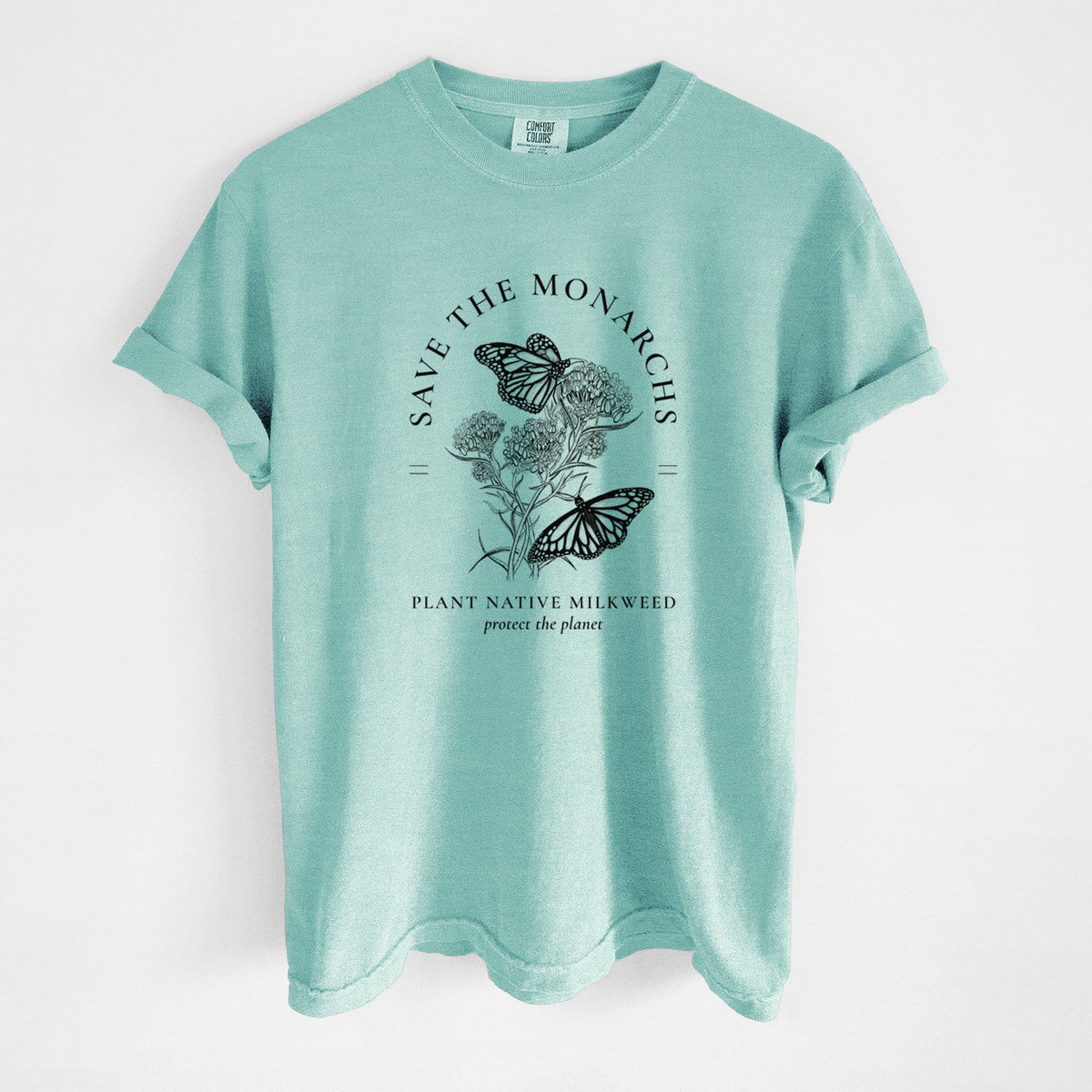 Chalky mint Comfort Colors t-shirt laid flat, printed with black ink monarch butterflies on milkweed flowers, framed by the words Save the Monarchs, Plant Native Milkweed.