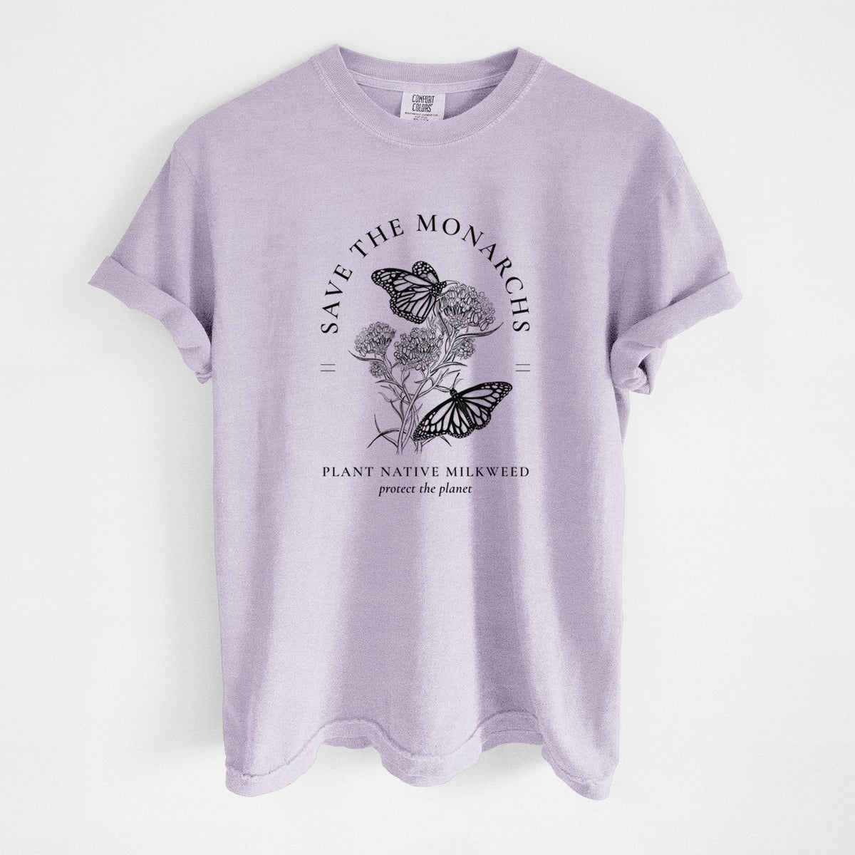 Orchid purple Comfort Colors t-shirt laid flat, printed with black ink monarch butterflies on milkweed flowers, framed by the words Save the Monarchs, Plant Native Milkweed.