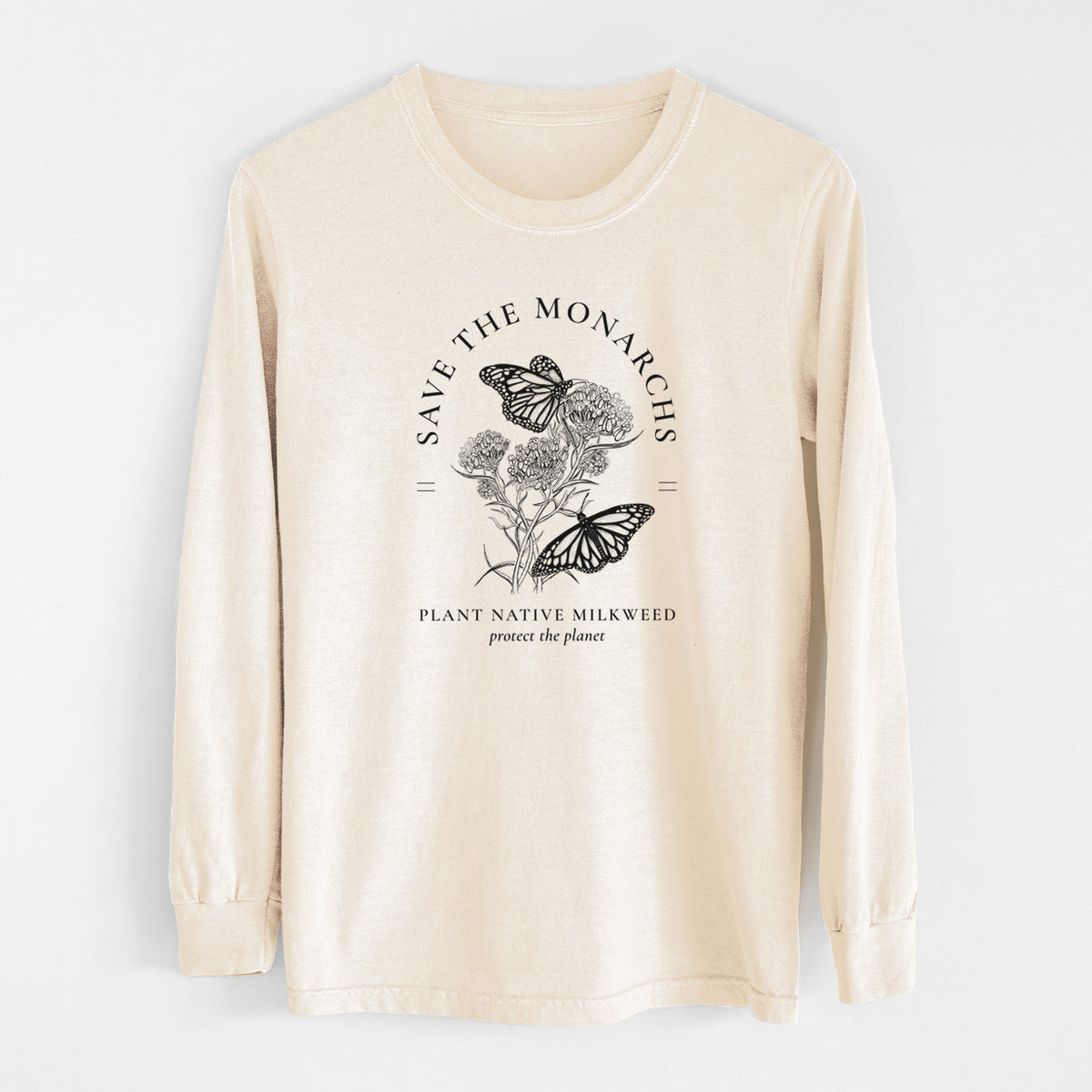 Ivory Comfort Colors long sleeve shirt laid flat, printed with black ink monarch butterflies on milkweed flowers, framed by the words Save the Monarchs, Plant Native Milkweed.