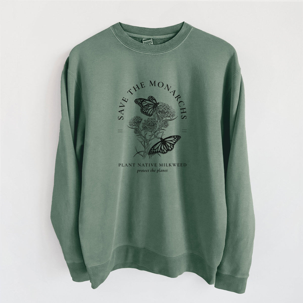 Alpine green pigment dyed crewneck sweatshirt laid flat, printed with black ink monarch butterflies on milkweed flowers, framed by the words Save the Monarchs, Plant Native Milkweed.