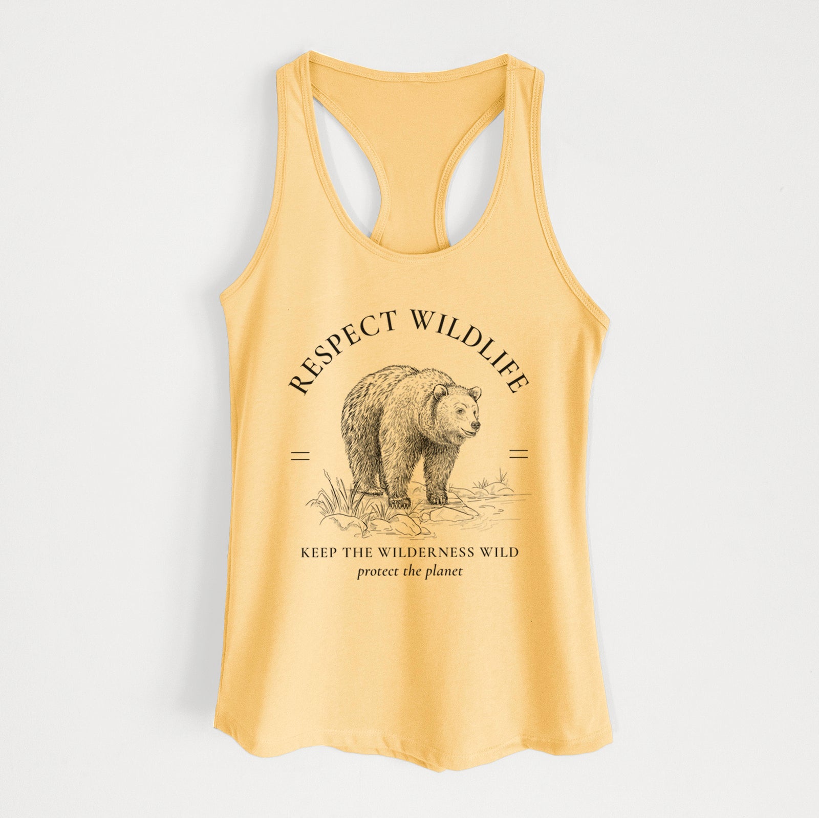 Banana cream women's racerback tank top laid flat, printed with a black ink bear framed by the words Respect Wildlife, Keep the Wilderness Wild.